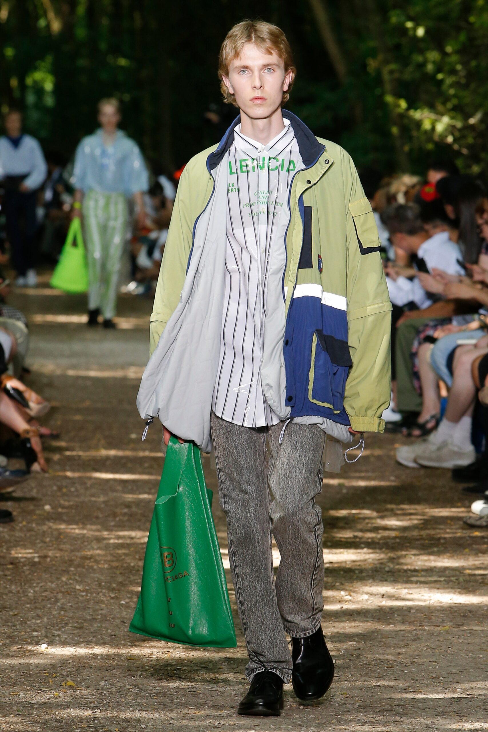 green jacket with striped shirt