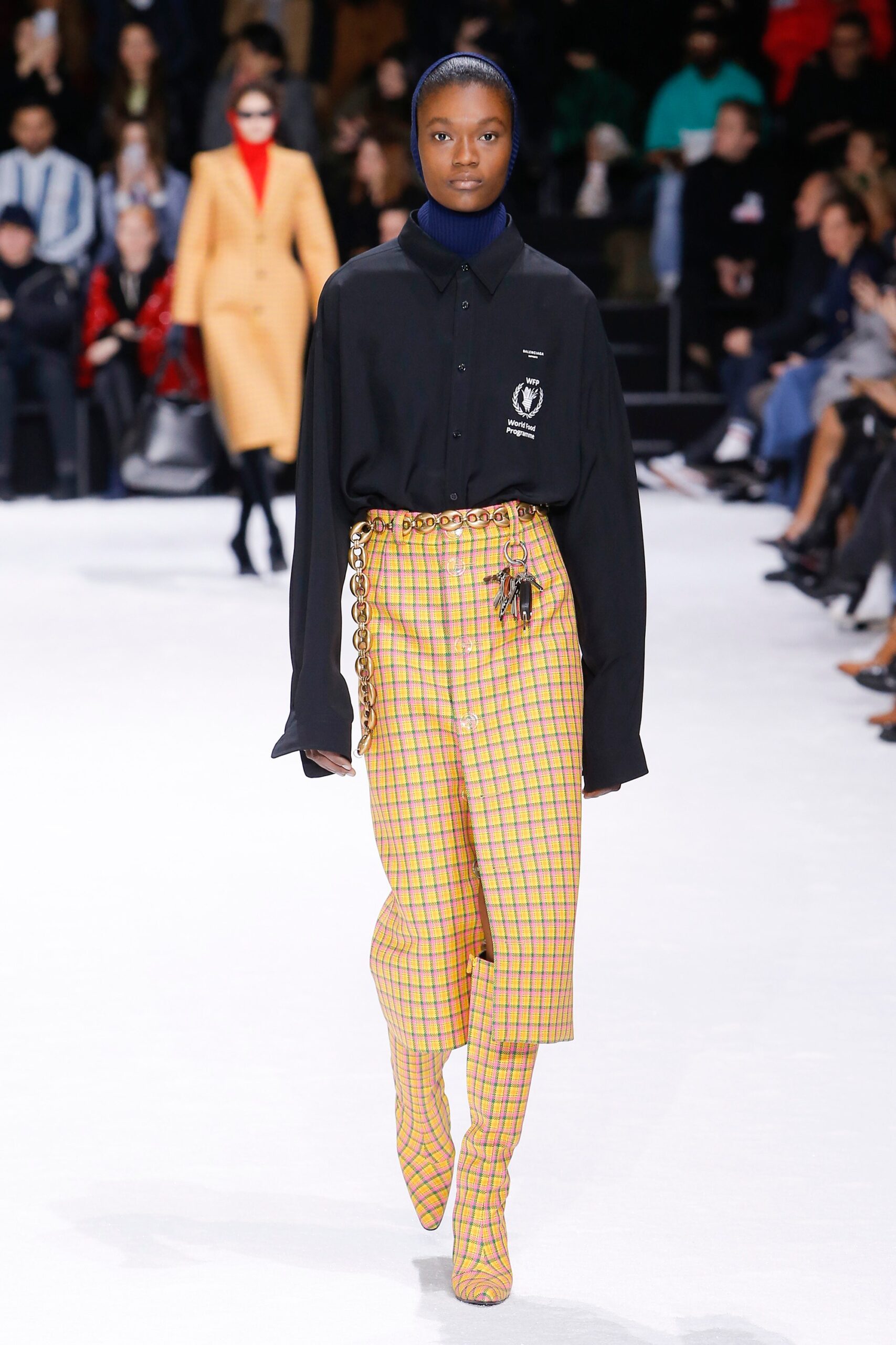 black shirt yellow checked skirt