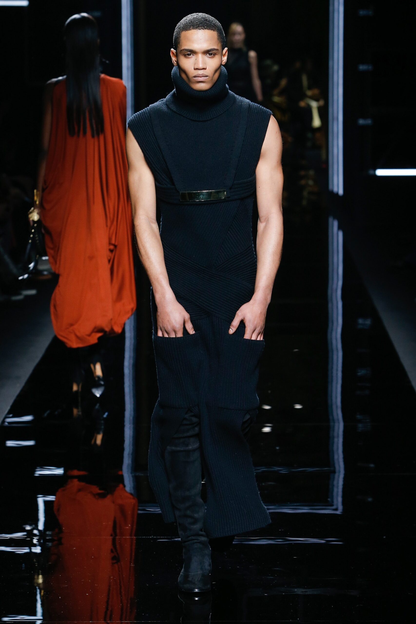 black knit fitted dress and red silk cape