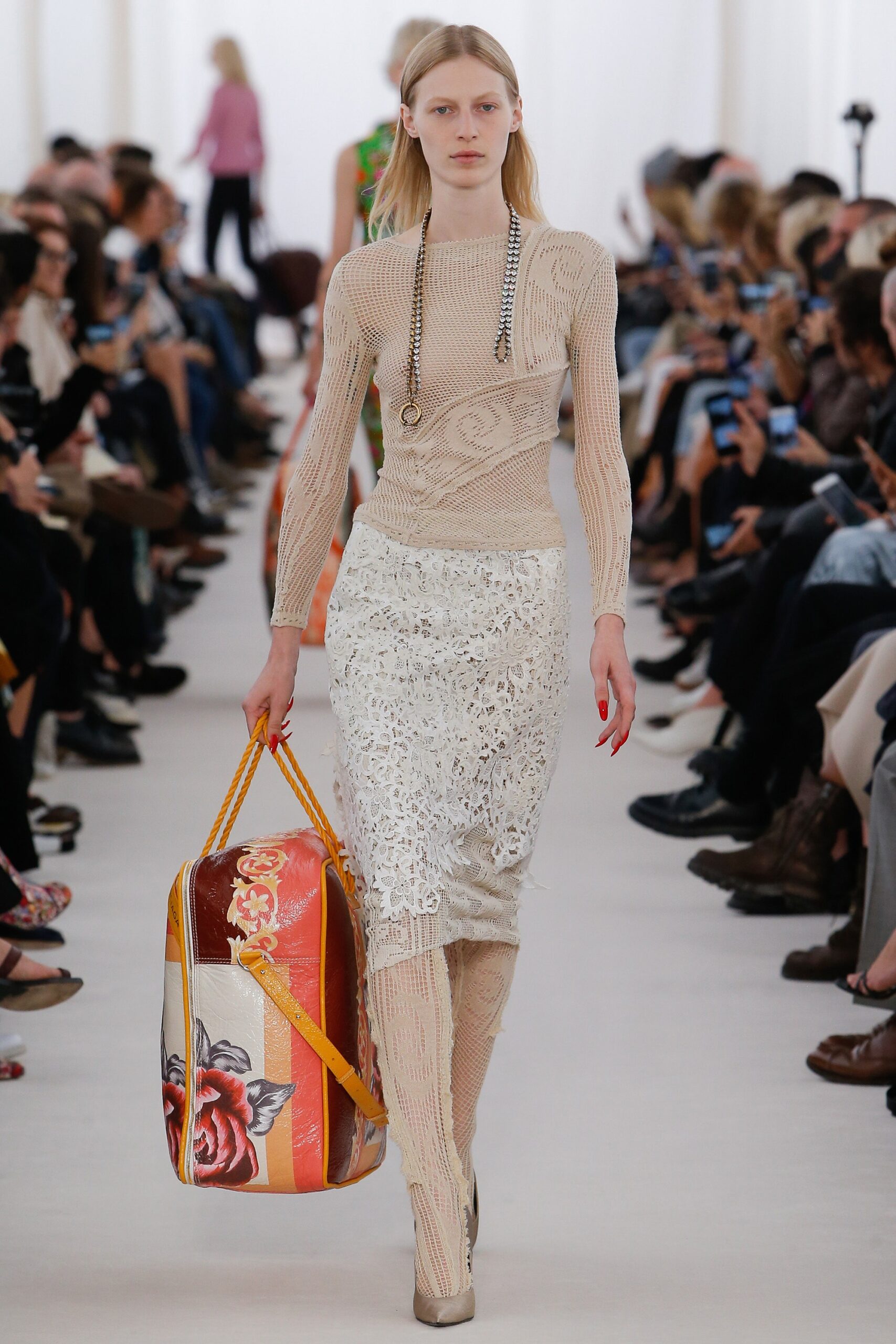 beige fitted knit top and white lace skirt