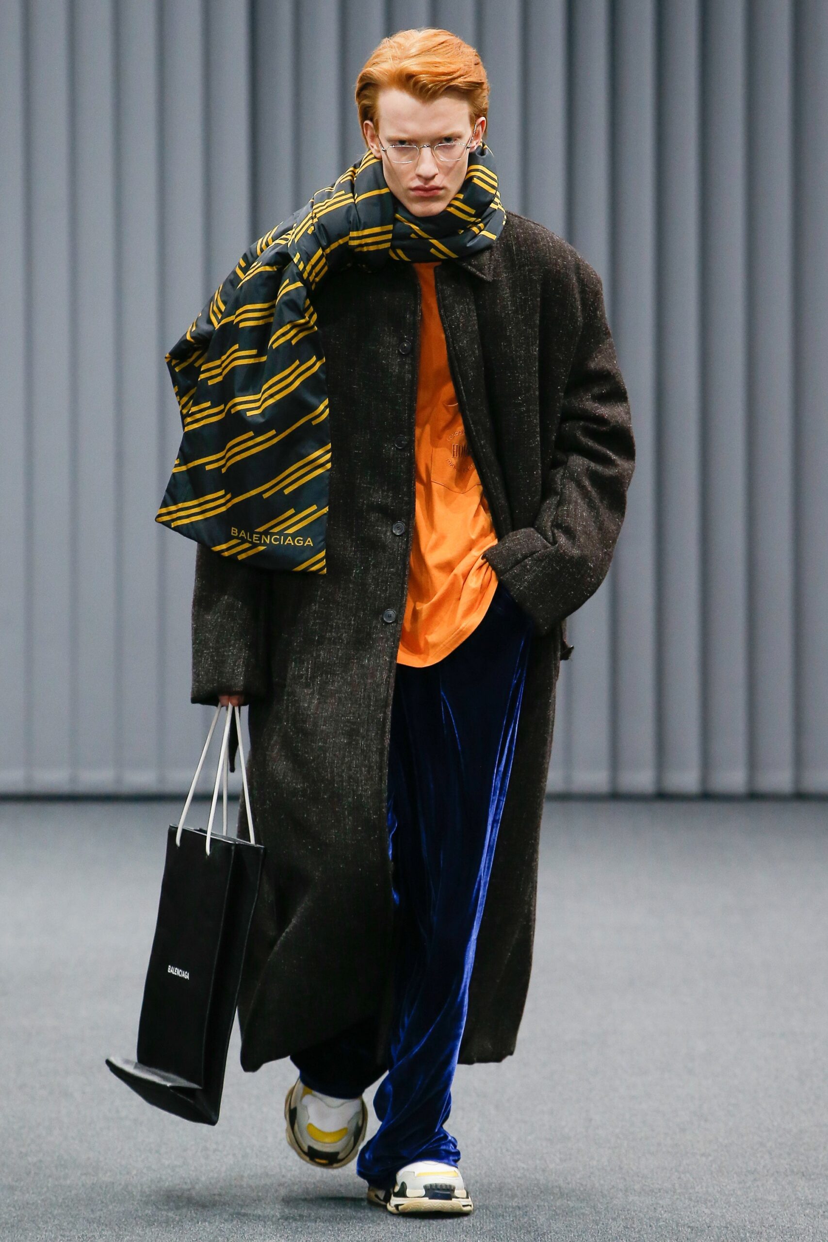 black wool coat with orange shirt