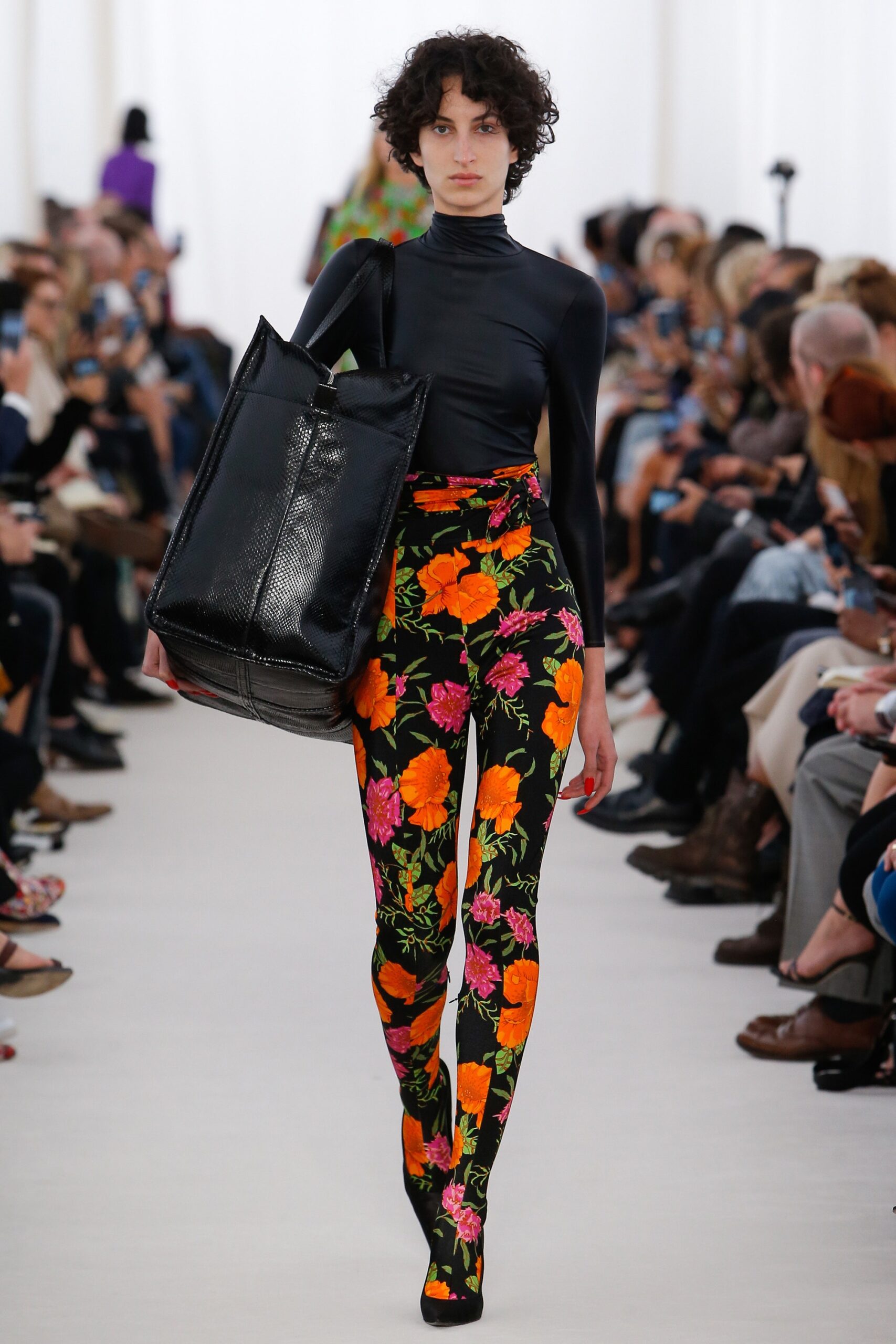 black fitted top with floral pants