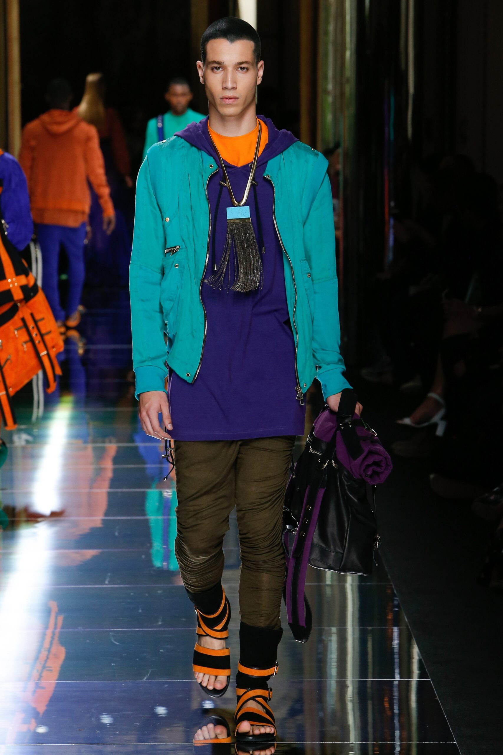teal jacket purple t-shirt cargo pants