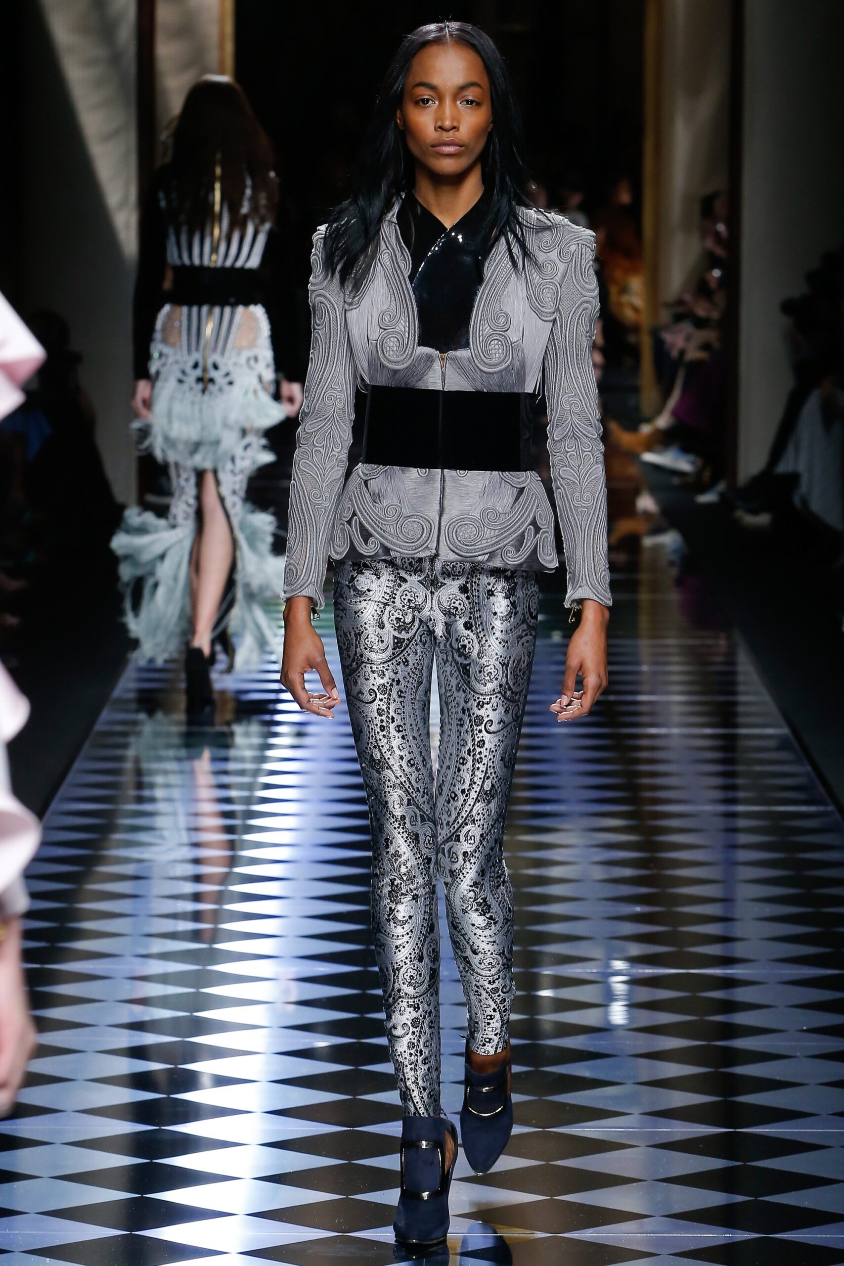 fitted black and white embroidered jacket with metallic pants