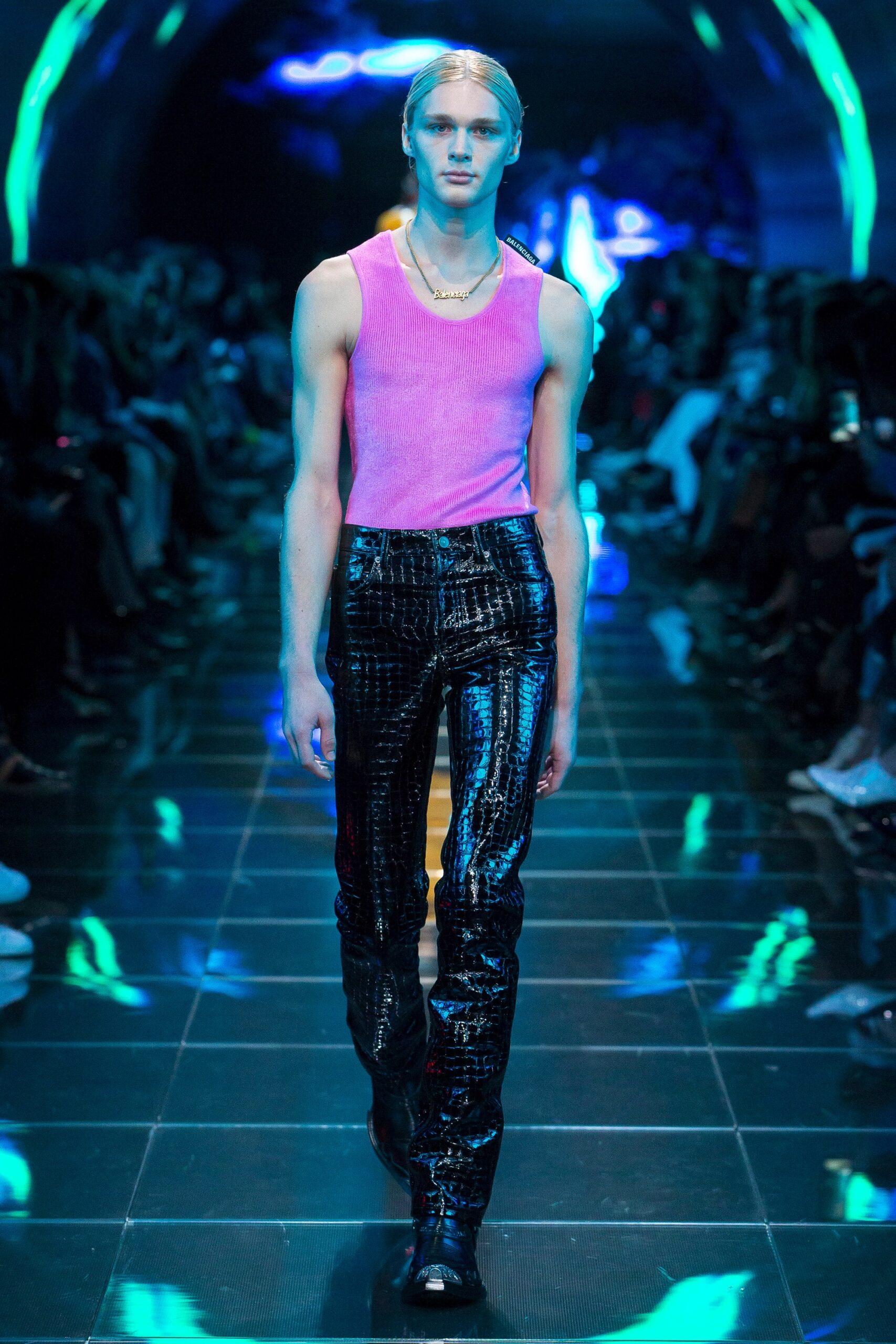 pink fitted tank-top and black vinyl pants