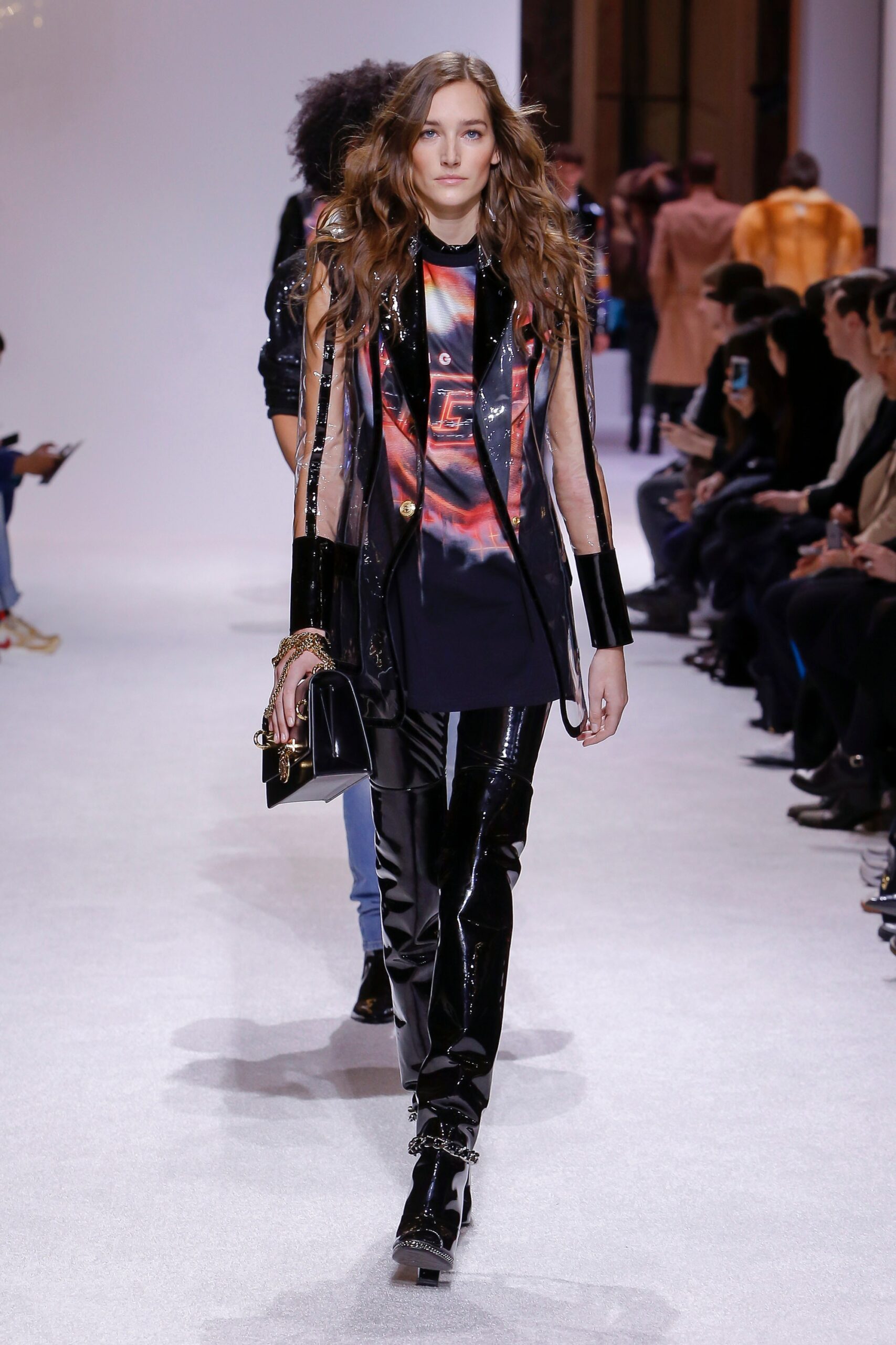 black fitted sleeveless top with vinyl pants