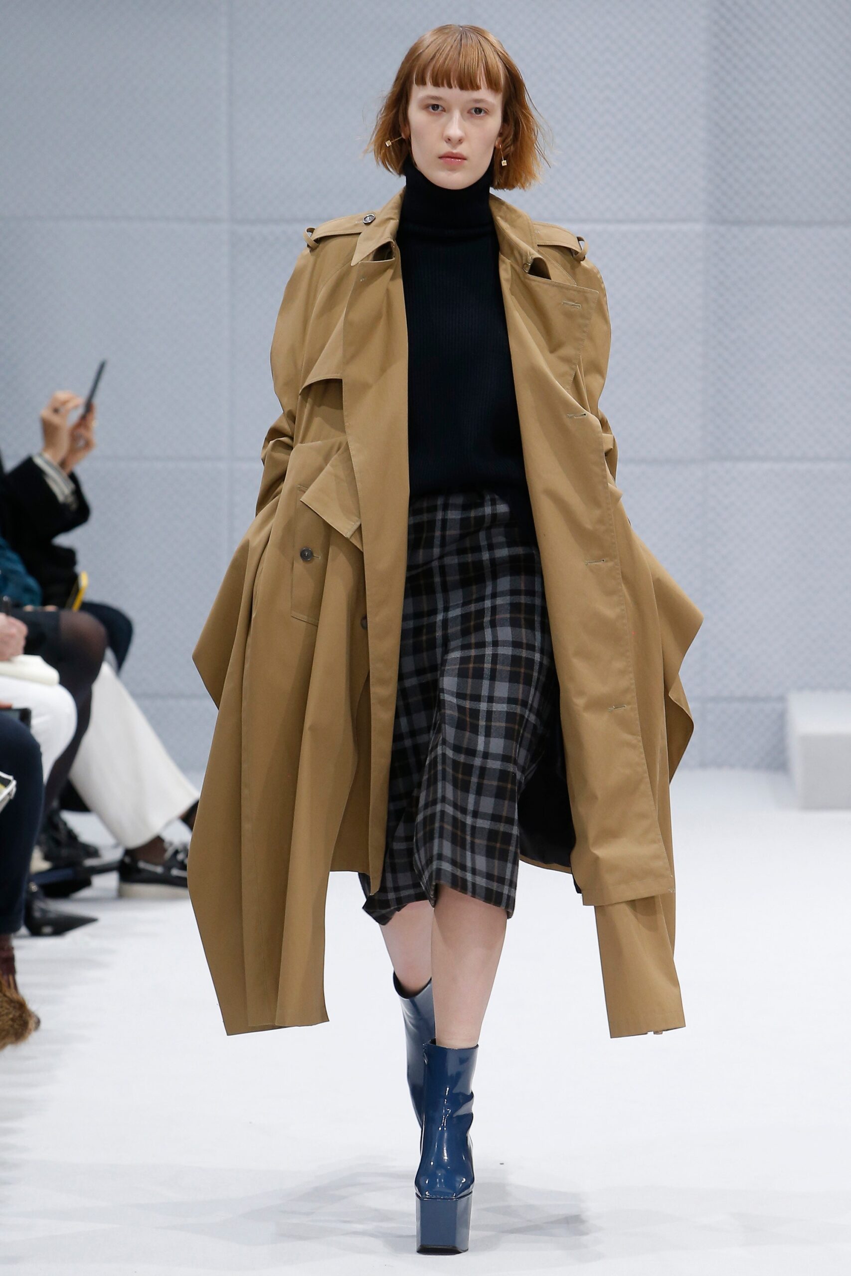 brown trench coat with black top