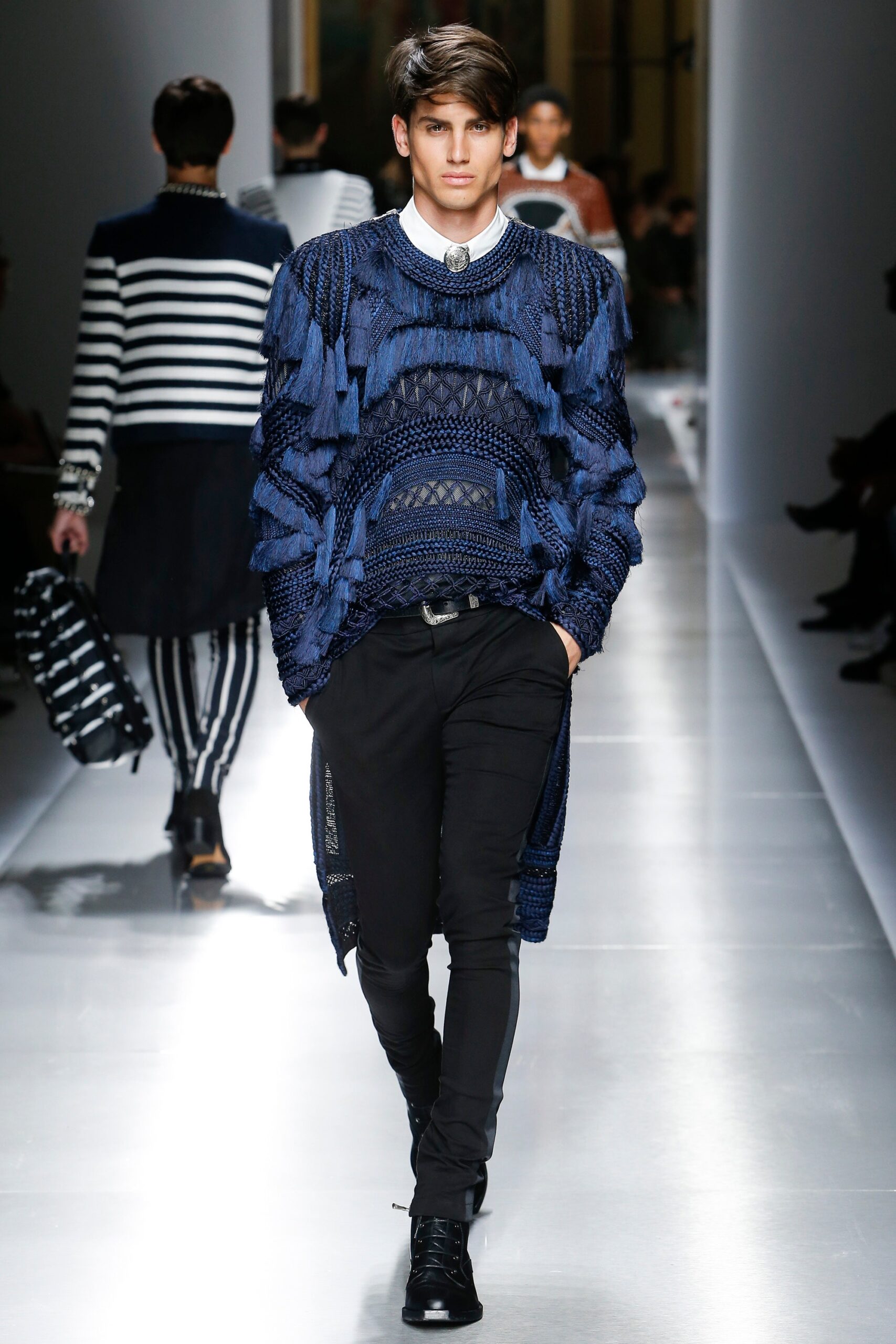 blue layered top with black pants