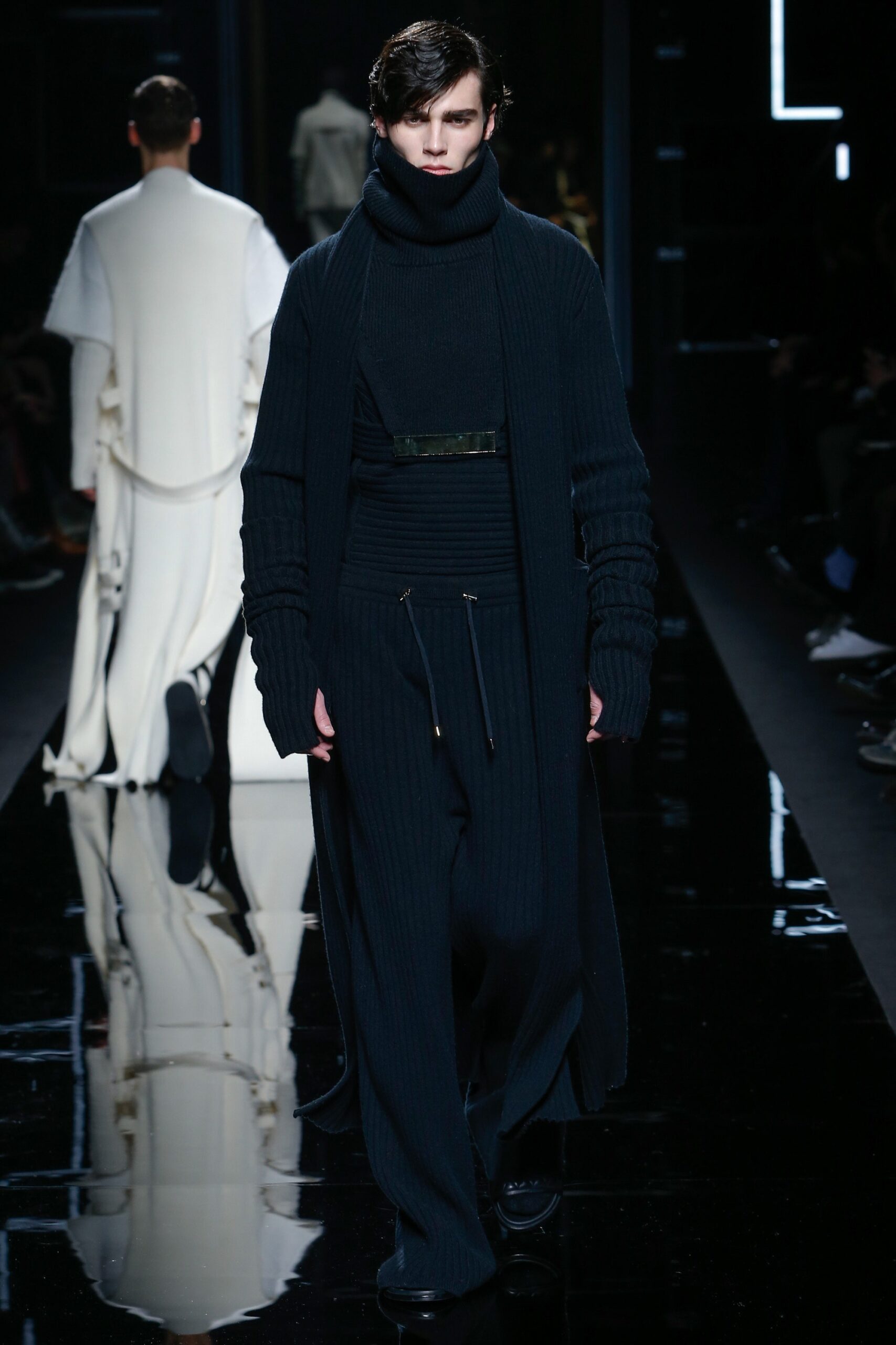 black fitted sweater and relaxed pants