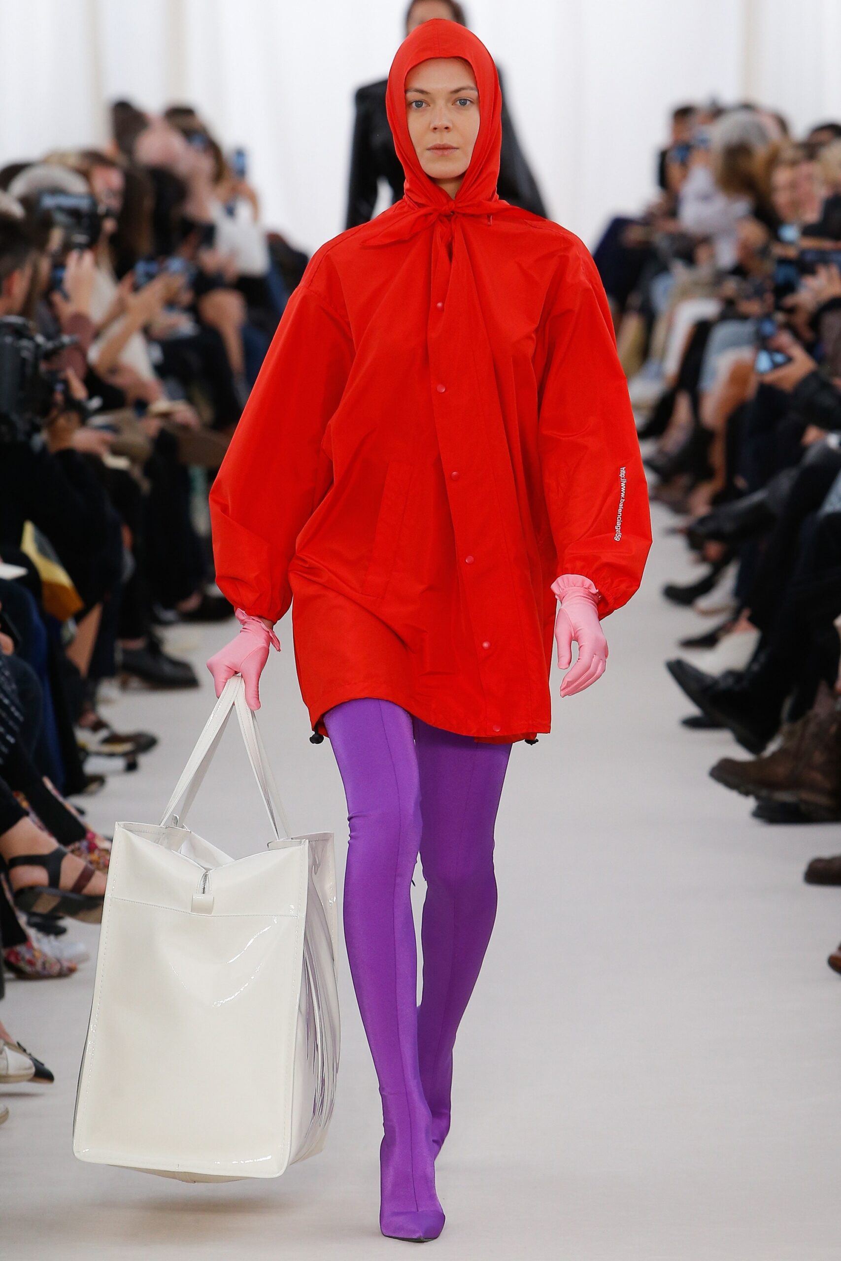 red vinyl poncho with purple leggings