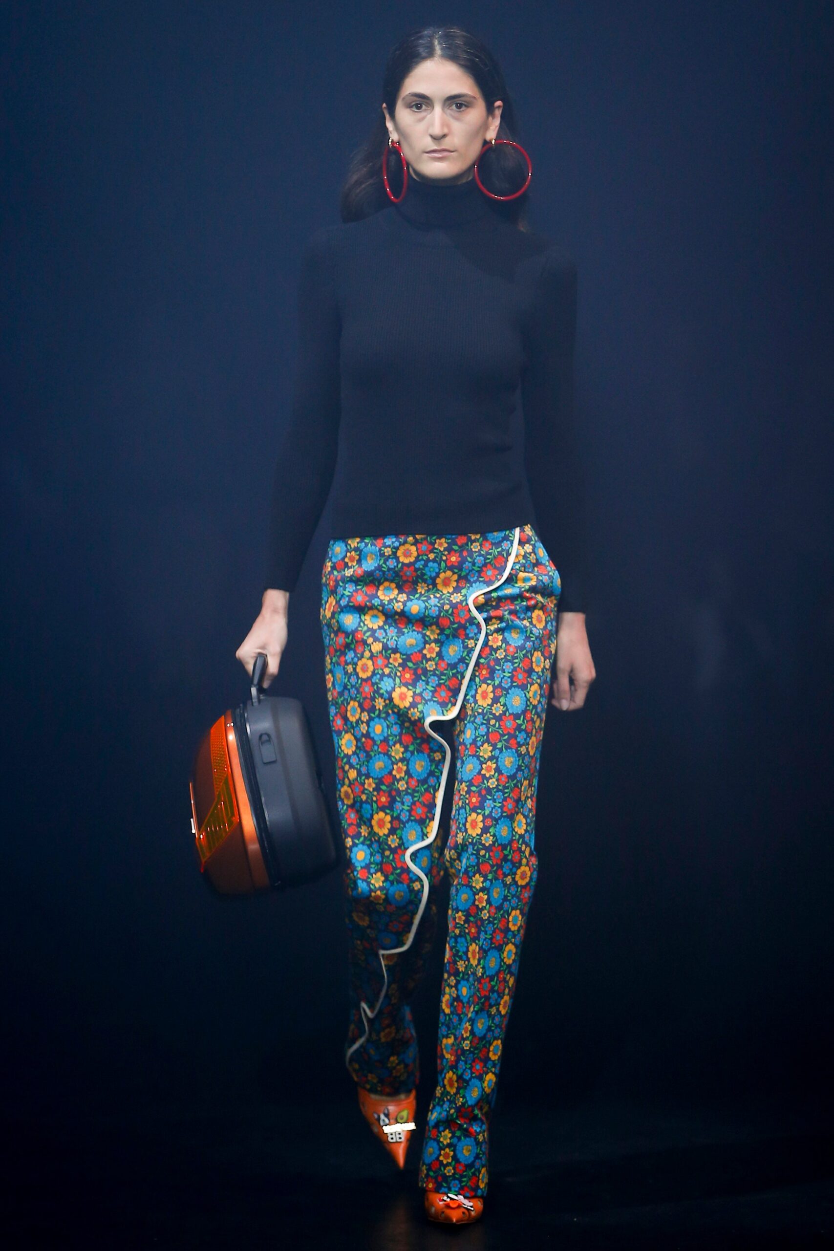 black fitted turtleneck with multi flared pants