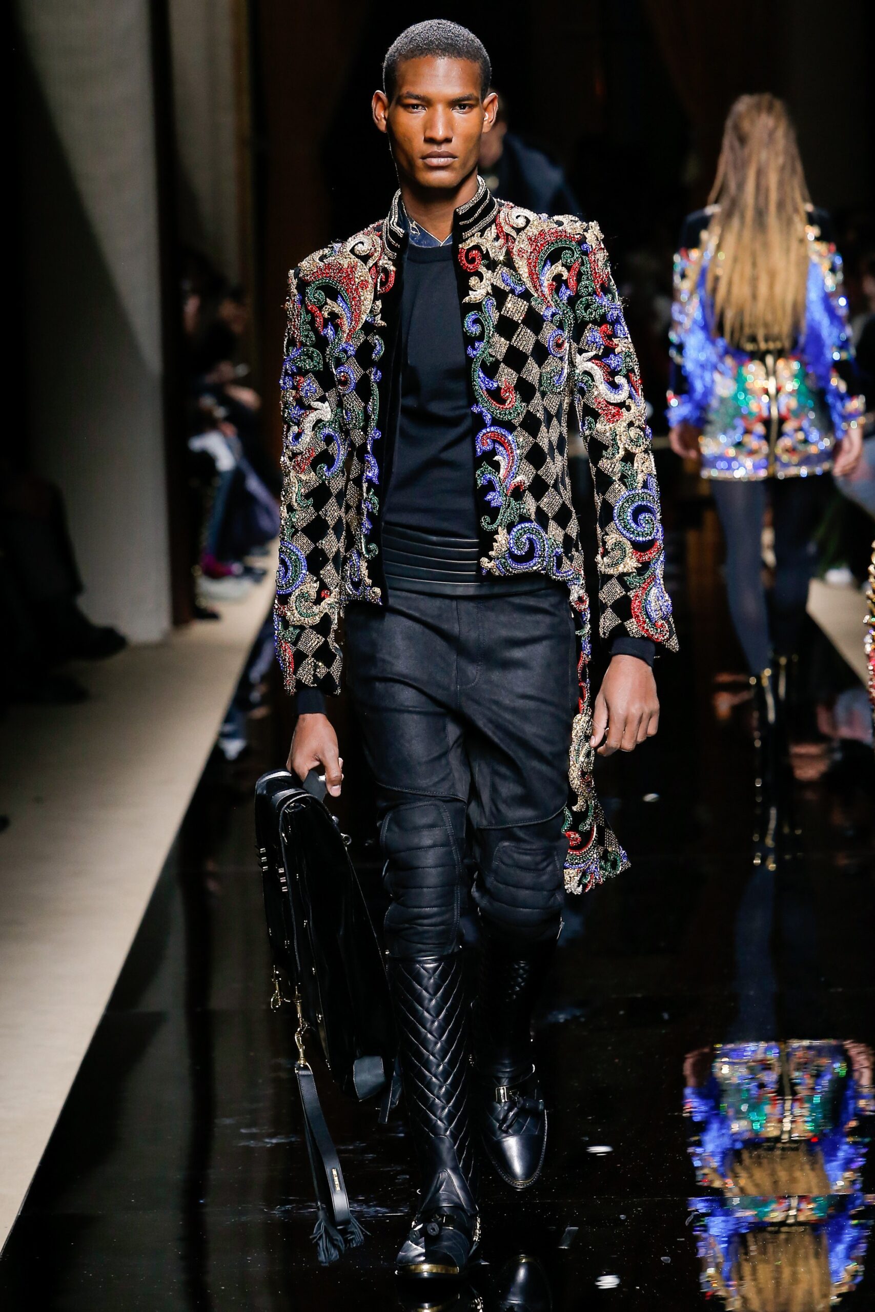 embroidered black coat with leather pants
