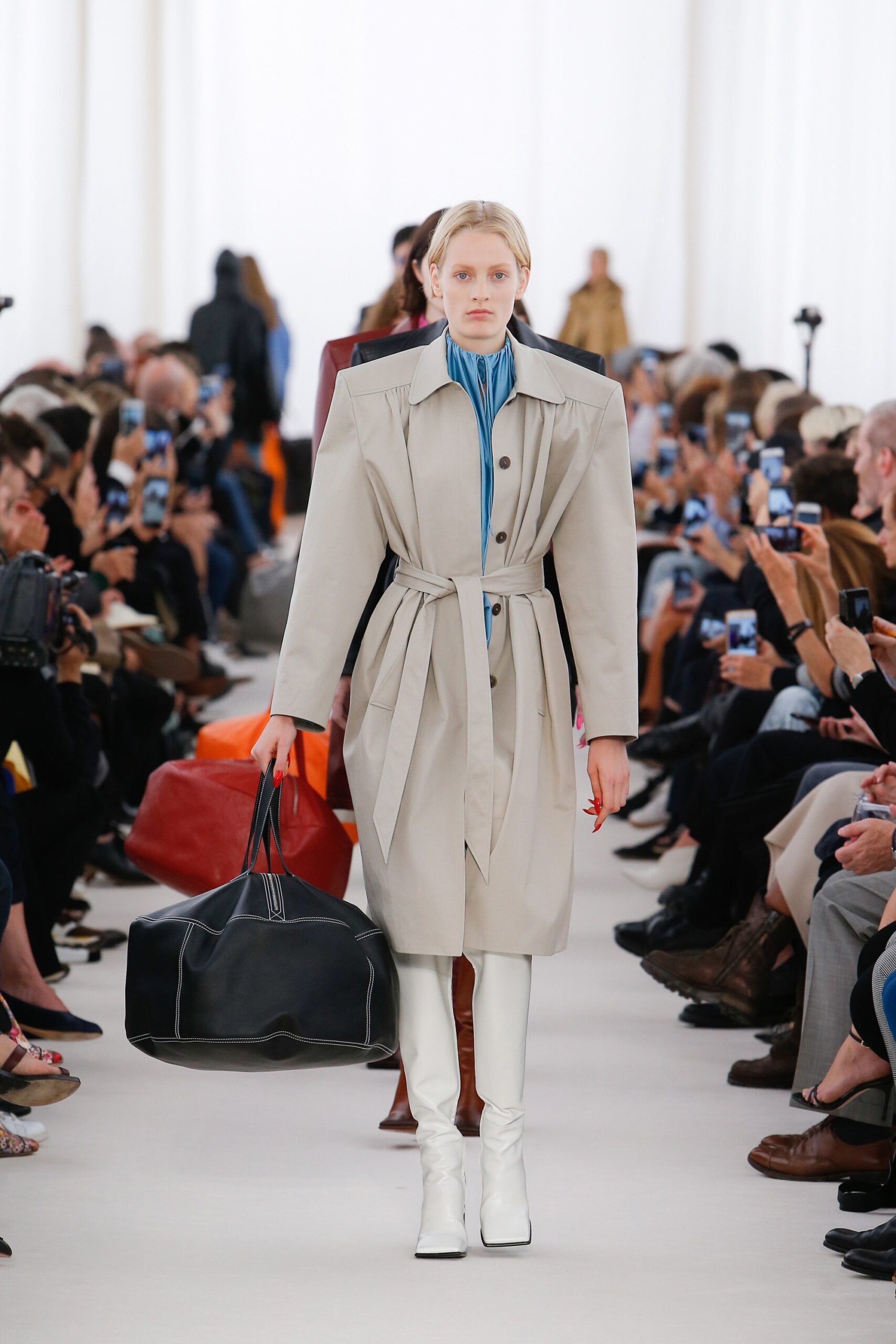 beige coat with blue top