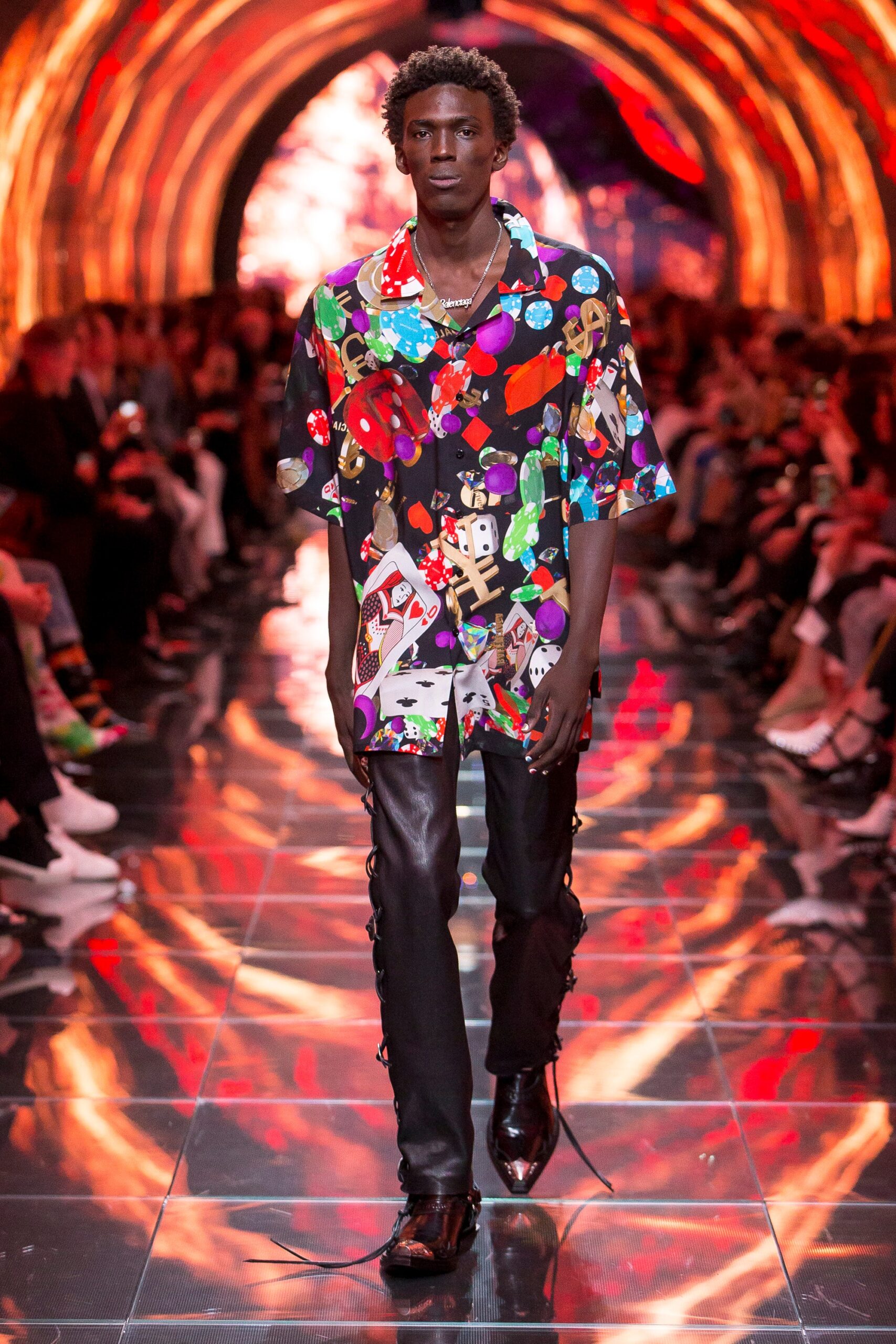 multi-colored printed shirt with black leather pants