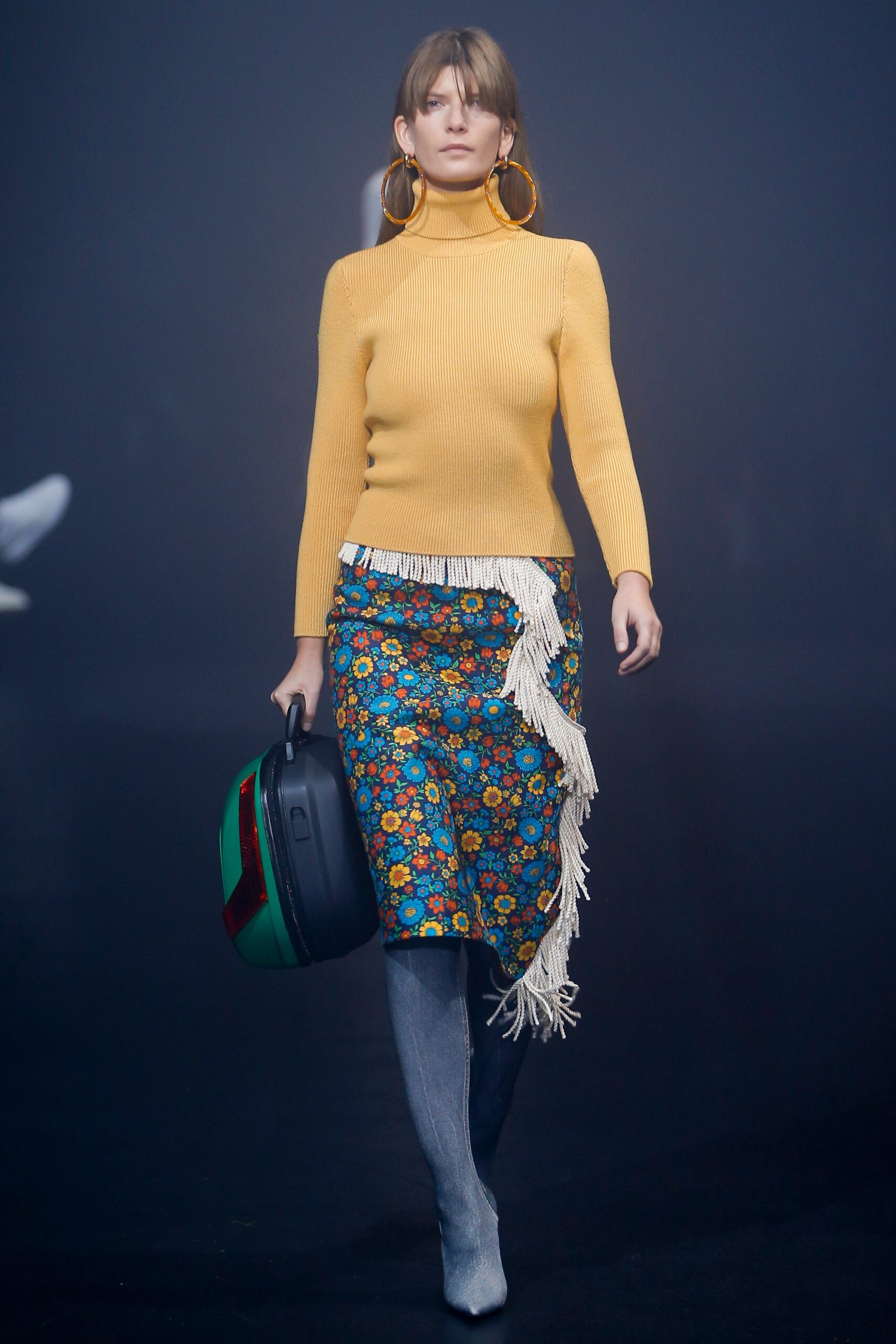 yellow knit turtleneck top with multi skirt
