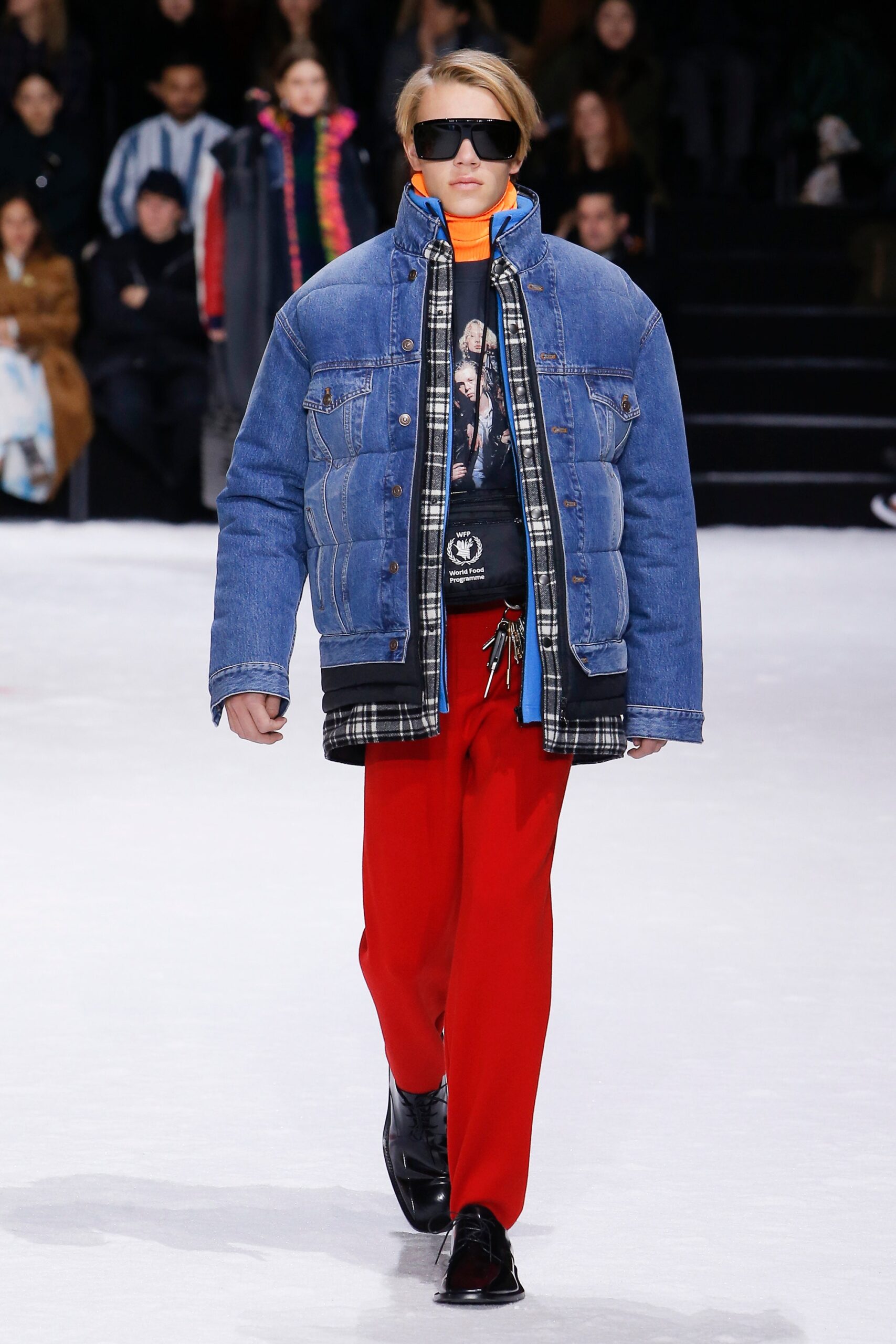 blue denim jacket with black t-shirt and red pants