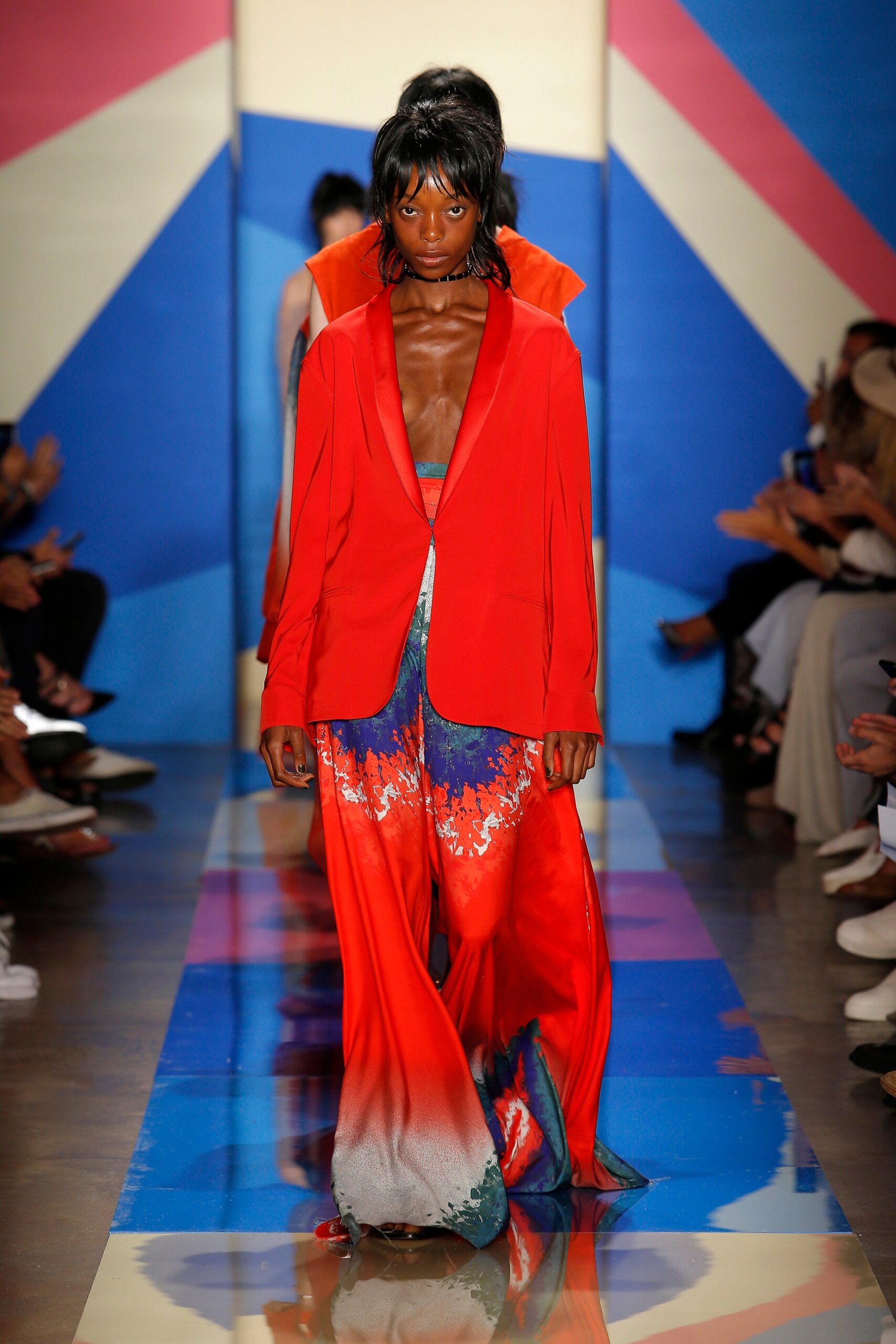red fitted blazer with multi-colored pants