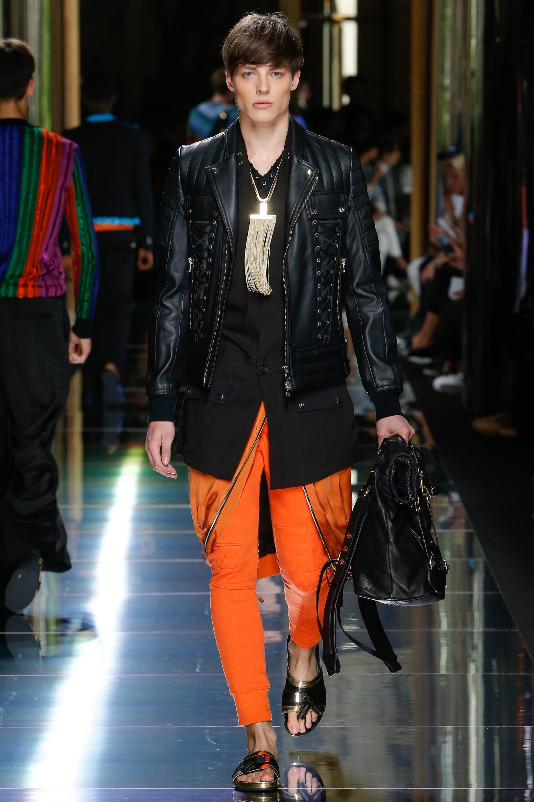 black leather jacket with orange pants