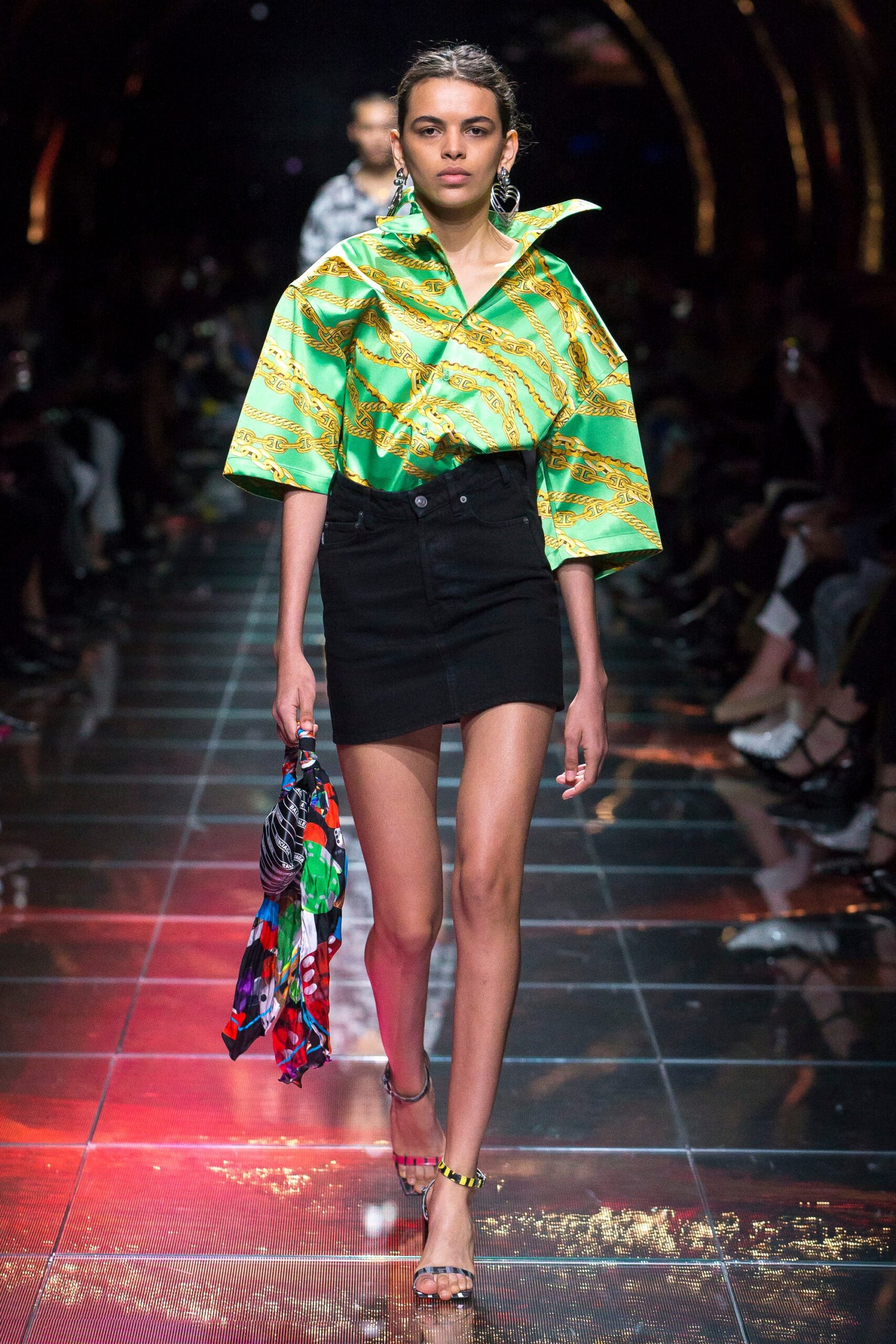 green printed top black skirt