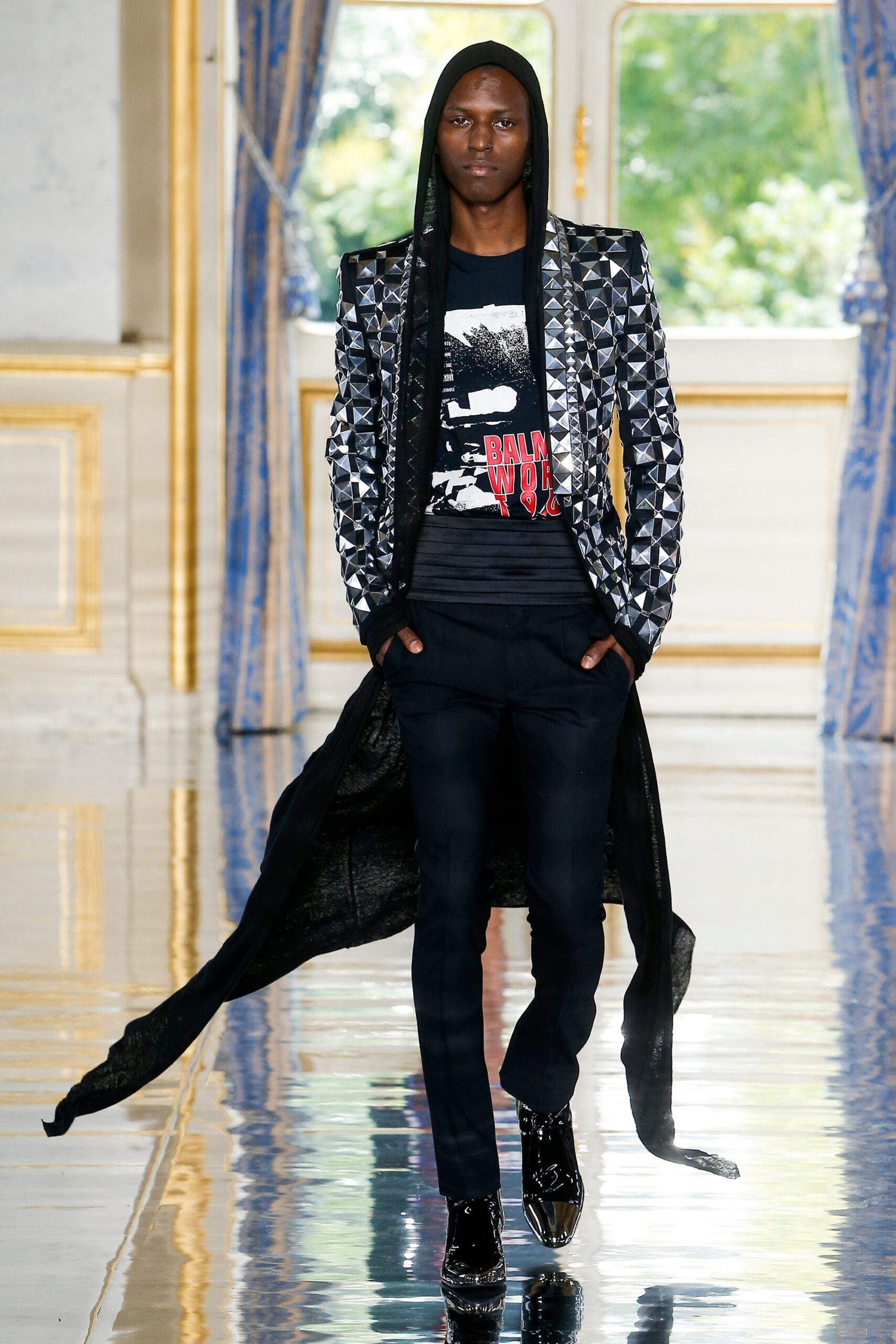 black layered coat with t-shirt and pants