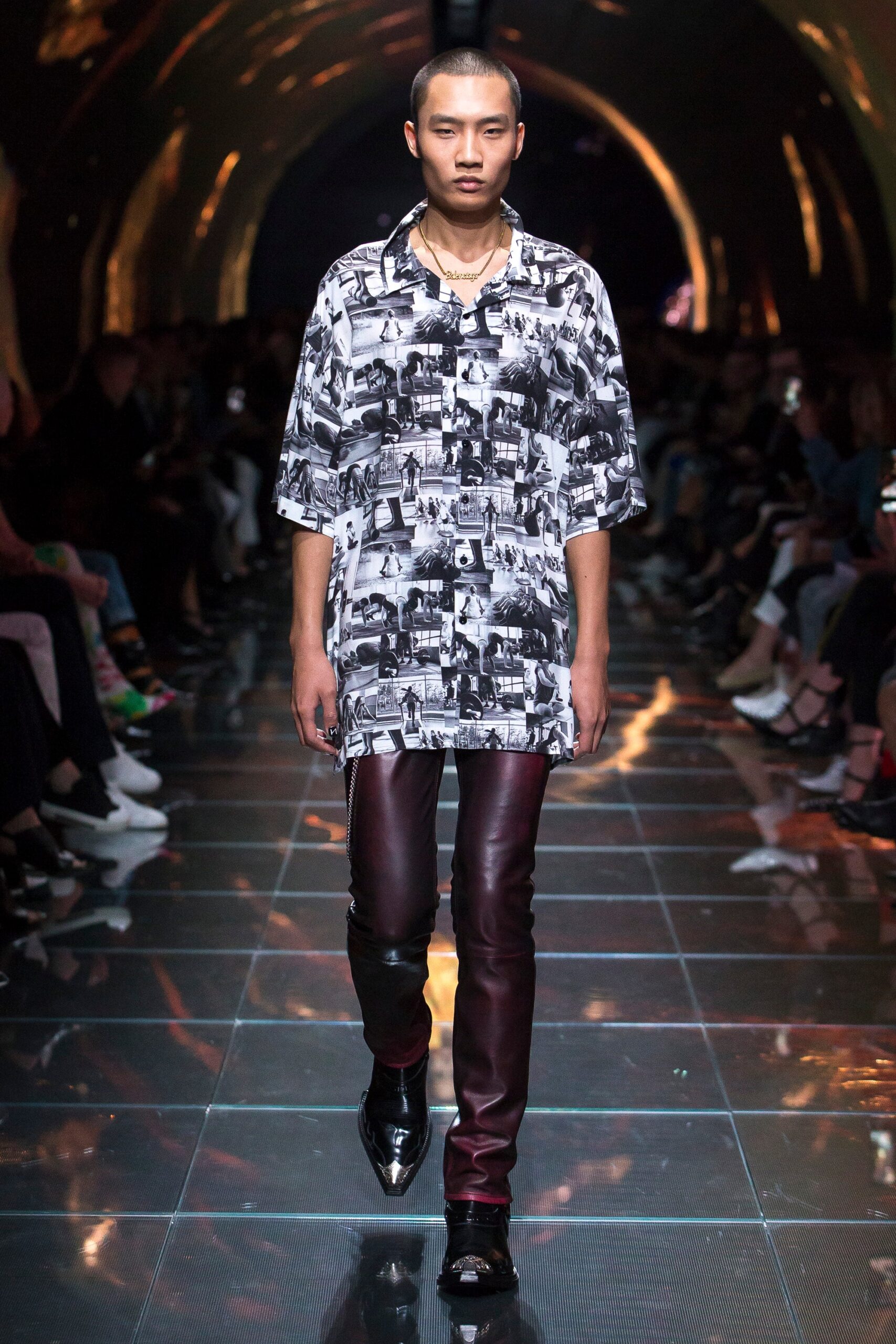 black and white printed shirt with red leather pants