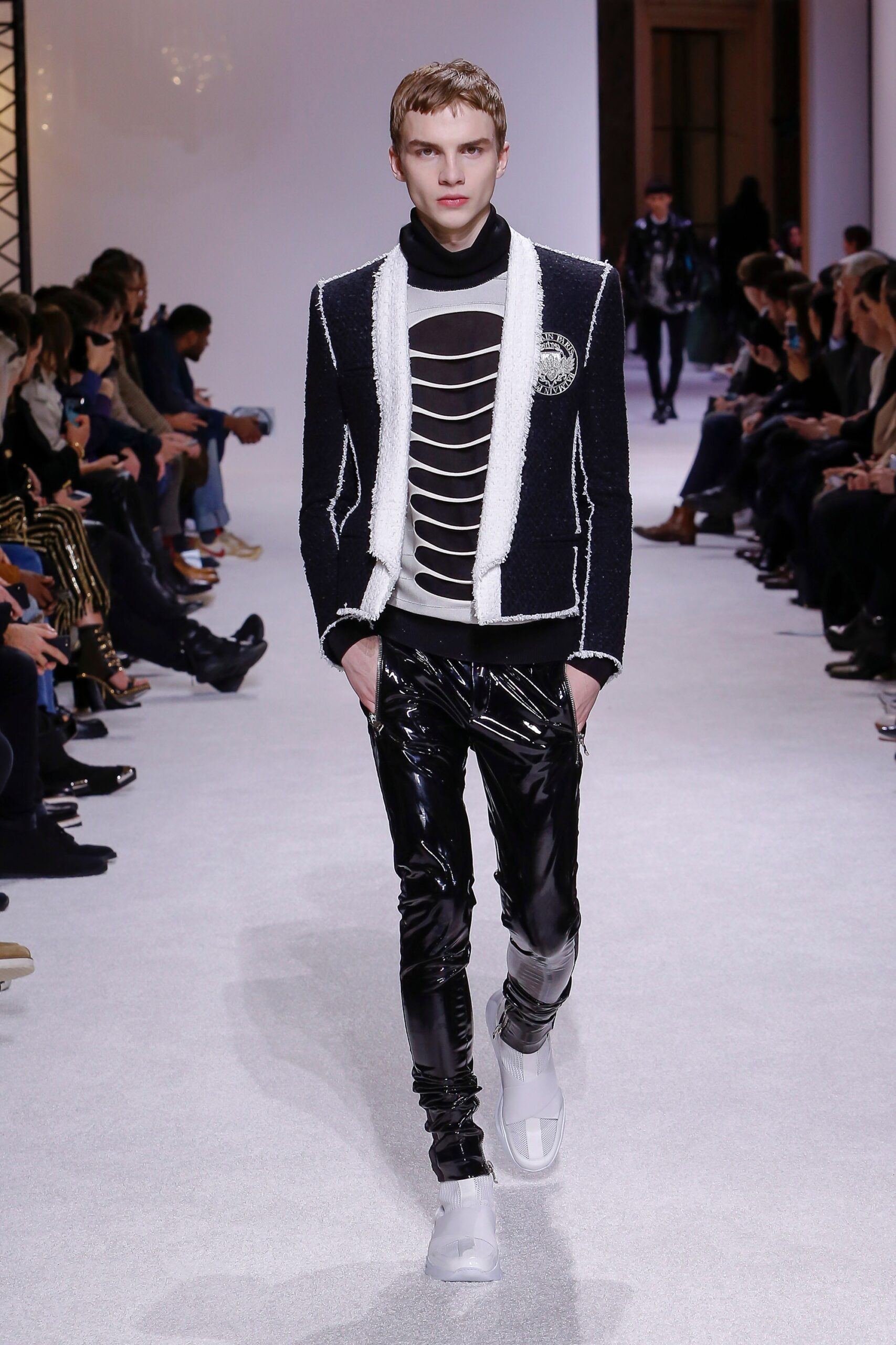 black and white fitted jacket with vinyl pants