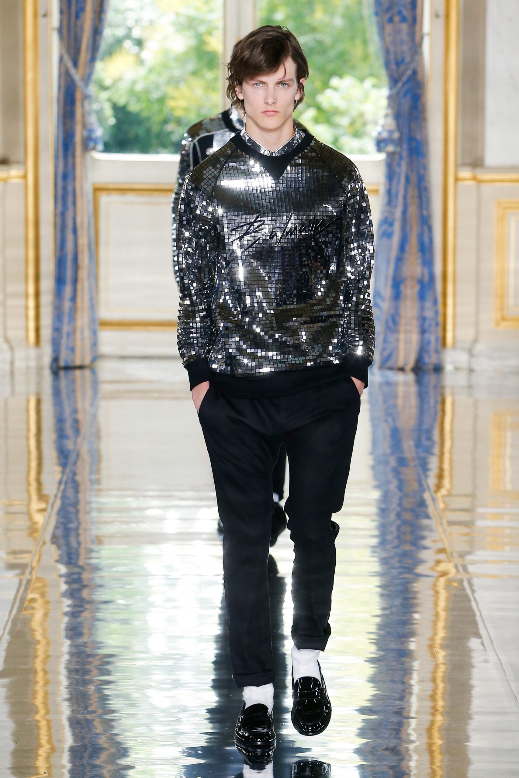 black sequined fitted sweater with tailored pants