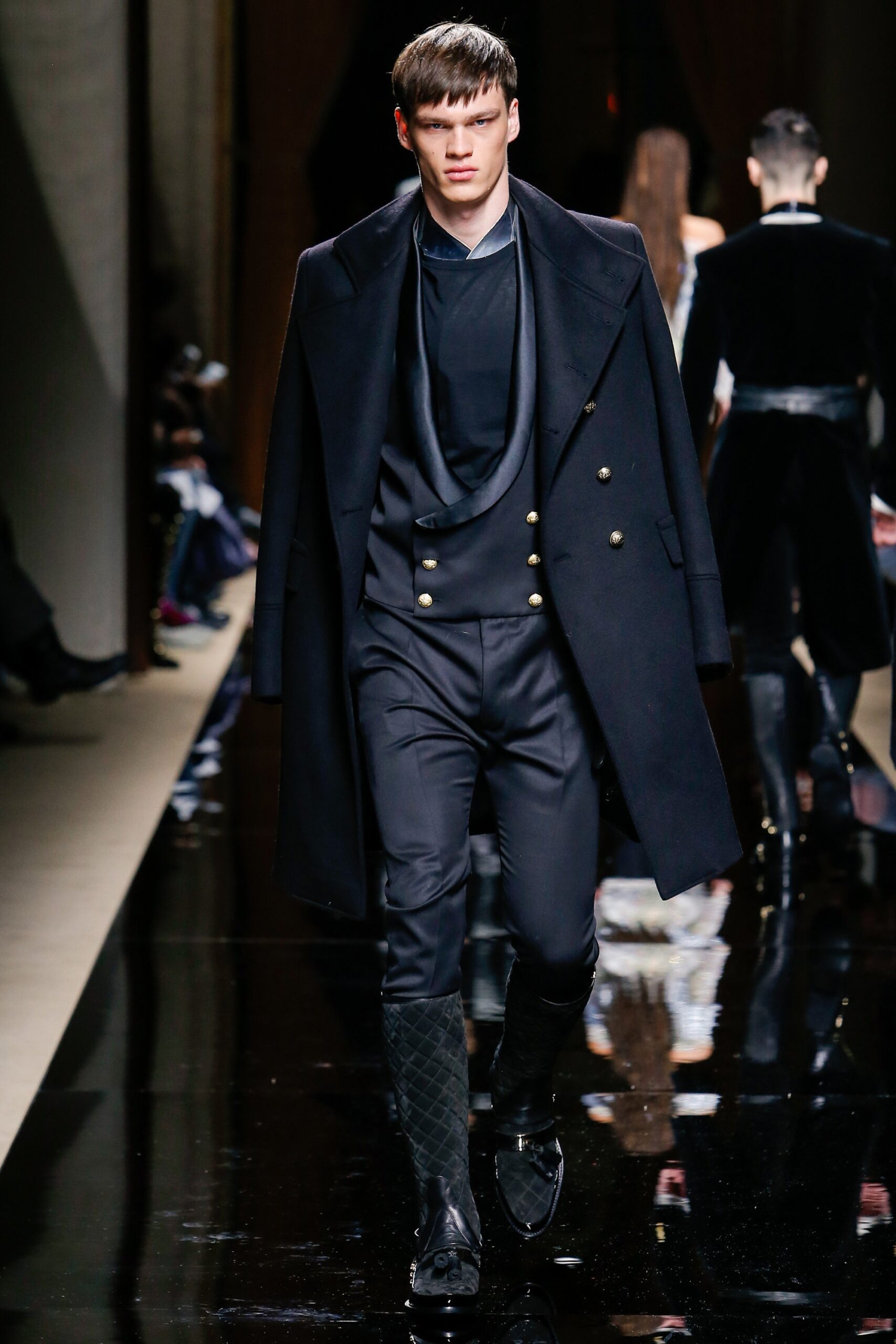 black tailored coat and slim pants