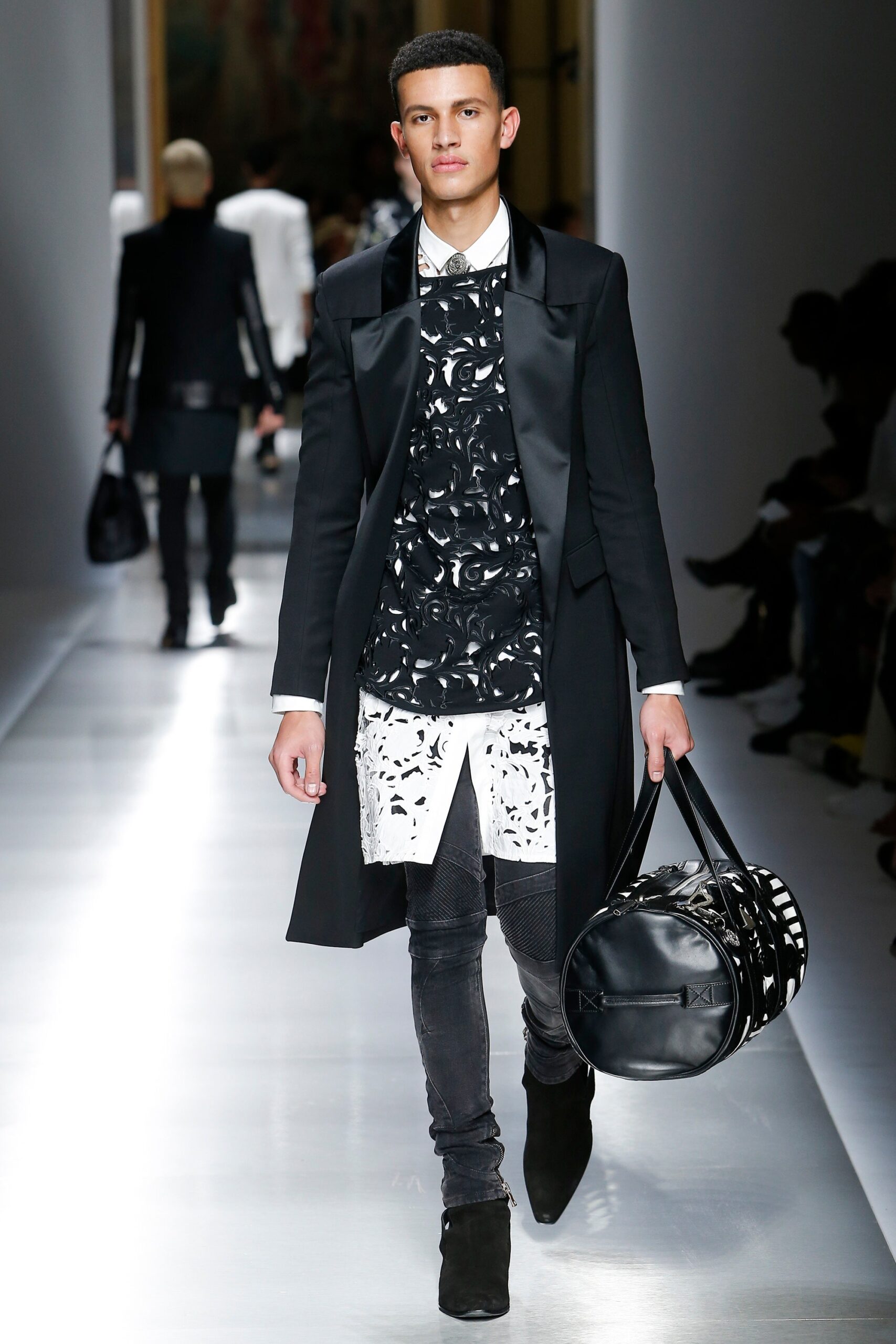 black wool coat with layered shirt