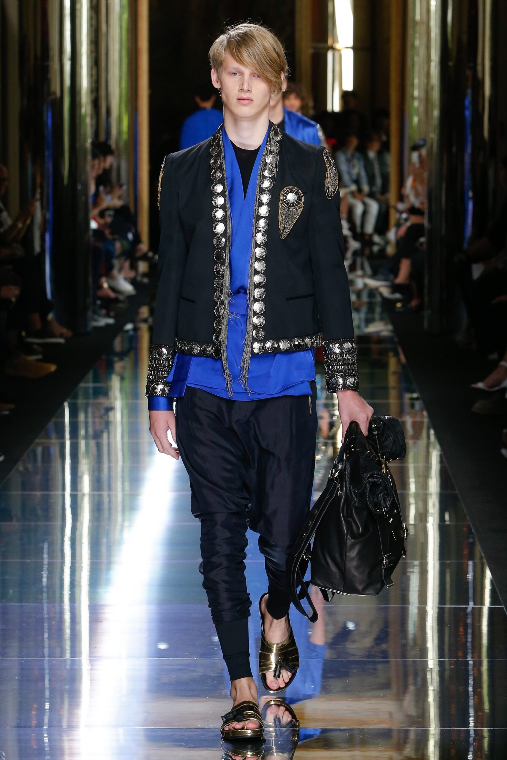 black embroidered jacket with blue pants