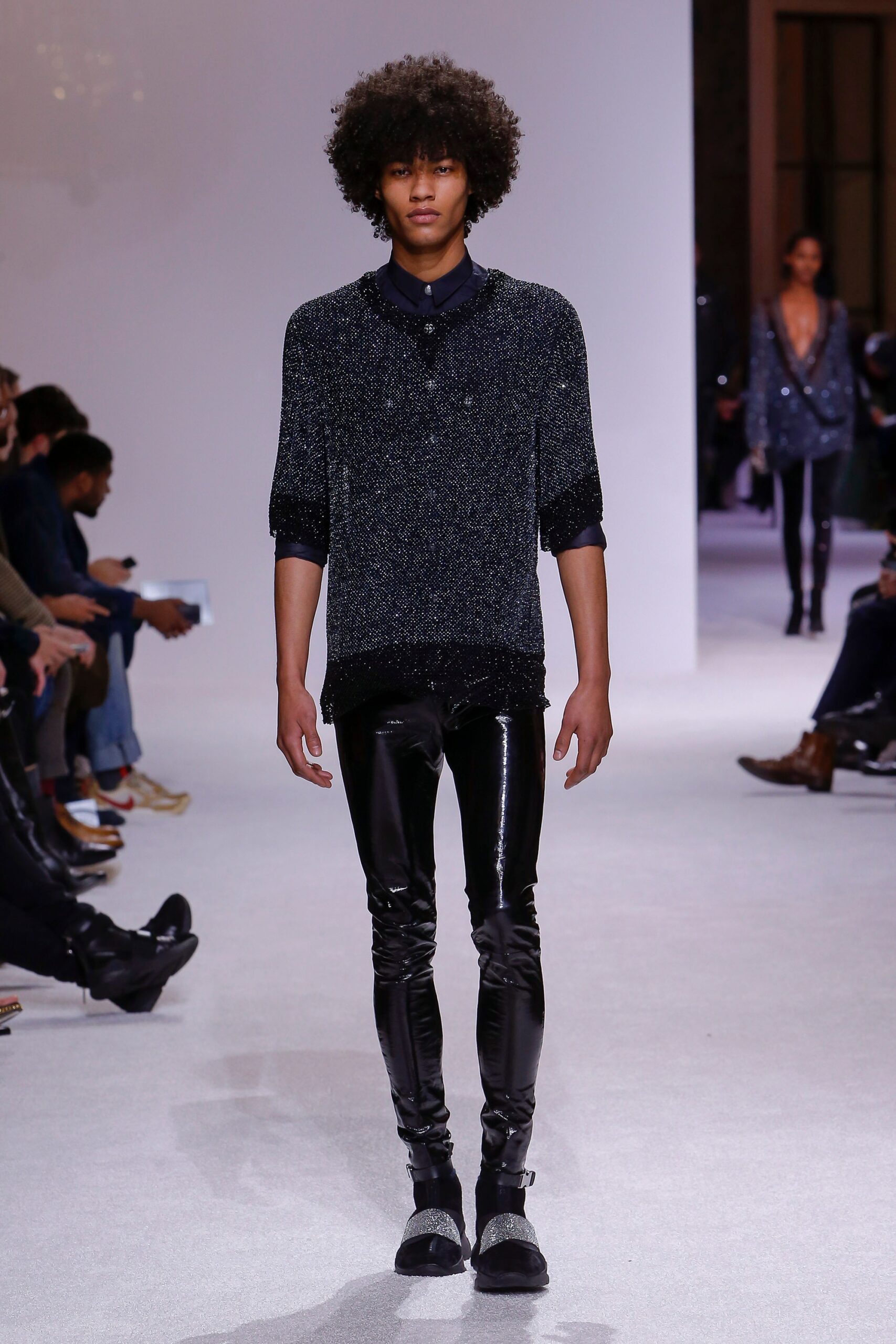 fitted black vinyl pants and top