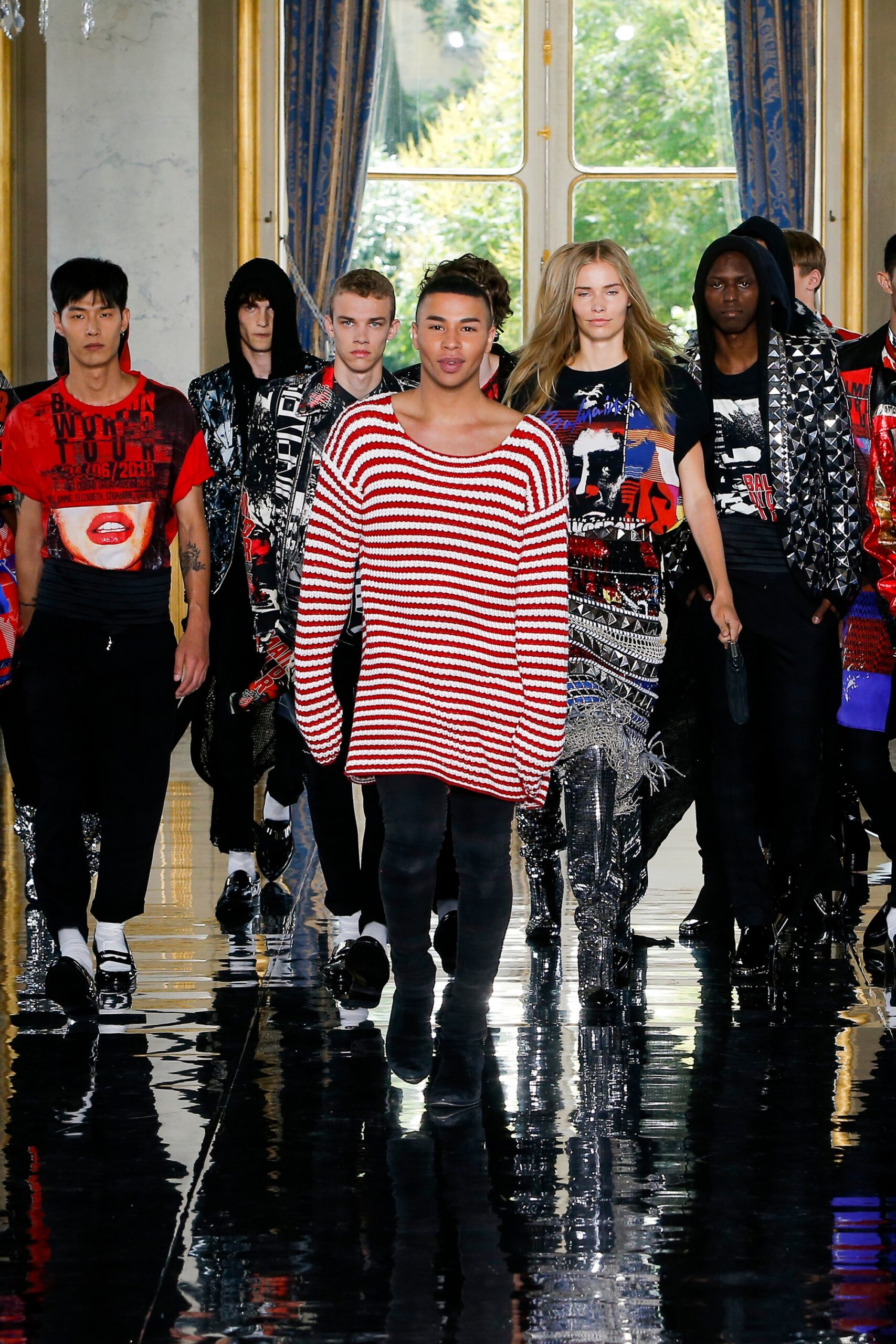 red and white striped sweater with black pants
