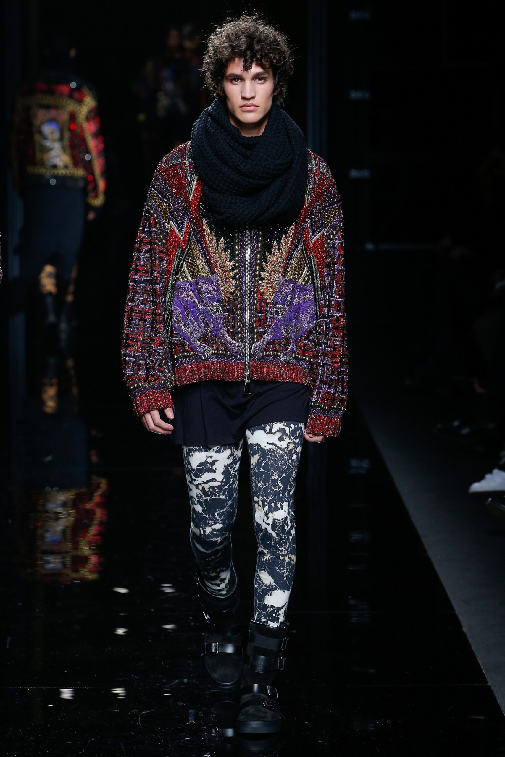 embroidered black sweater with distressed pants