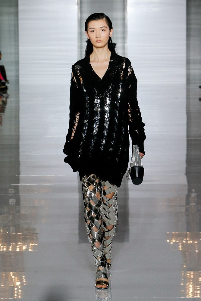 black oversized sweater with silver pants