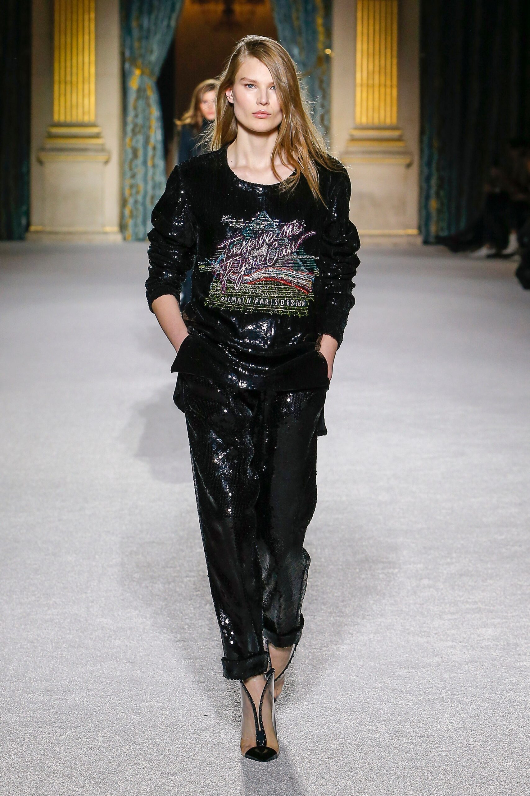 black sequin fitted sweater and relaxed pants