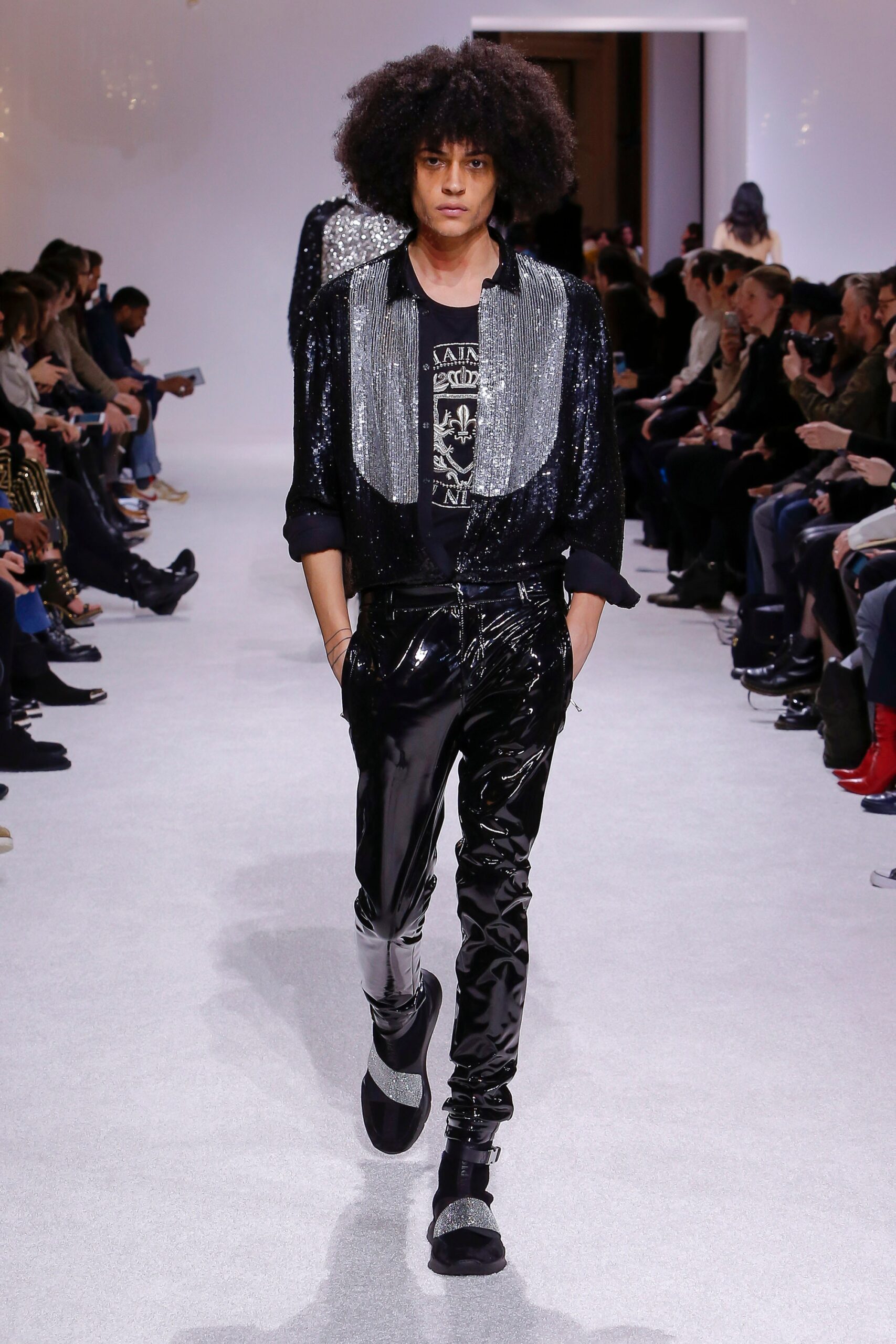 black sequined jacket with vinyl pants