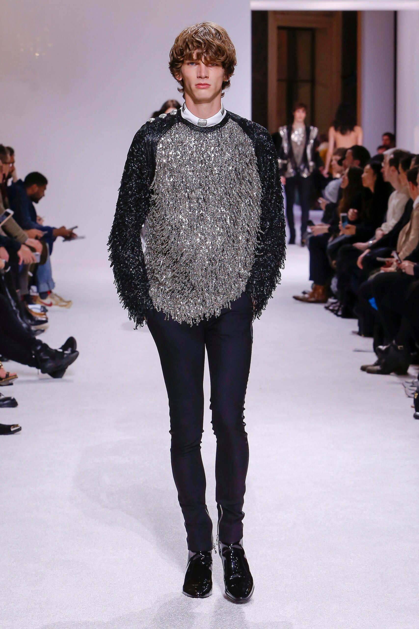 black and silver fringed top with slim pants