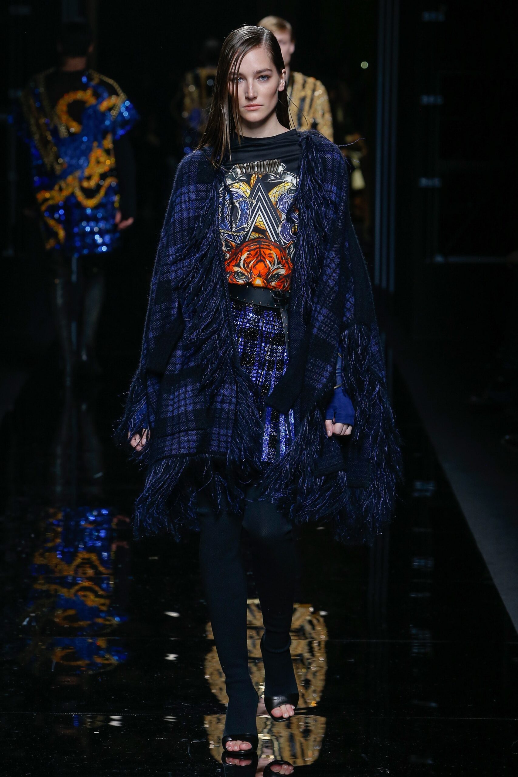 blue wool poncho and purple sequin skirt