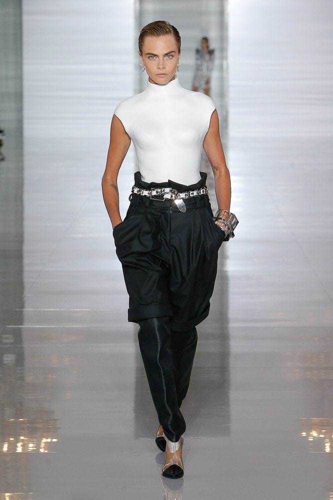 fitted white sleeveless top and relaxed black pants