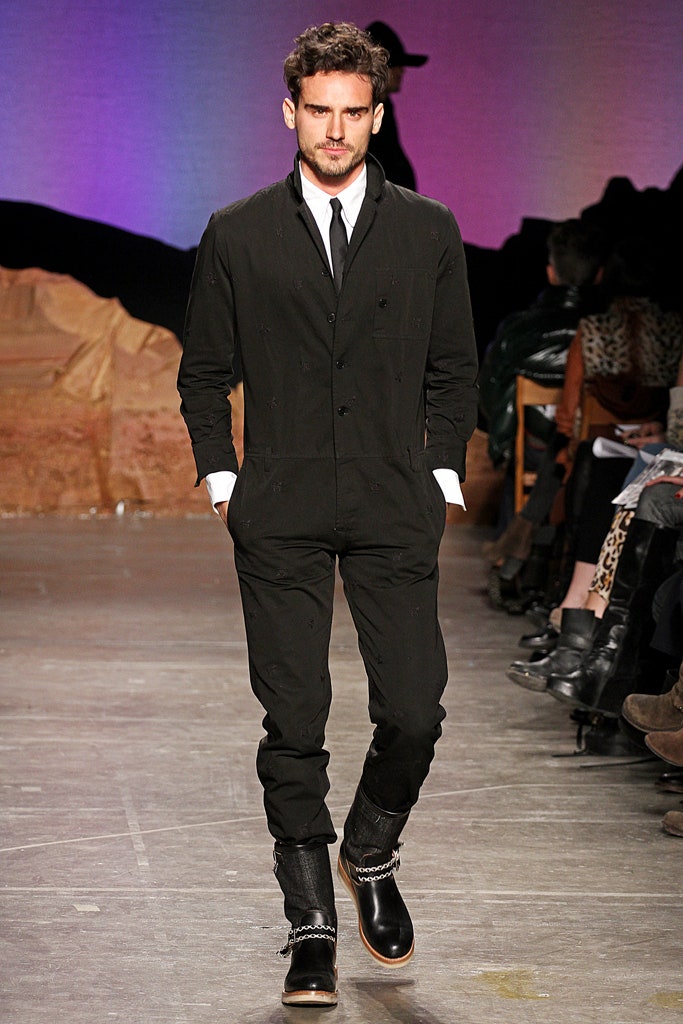 black fitted jumpsuit with boots