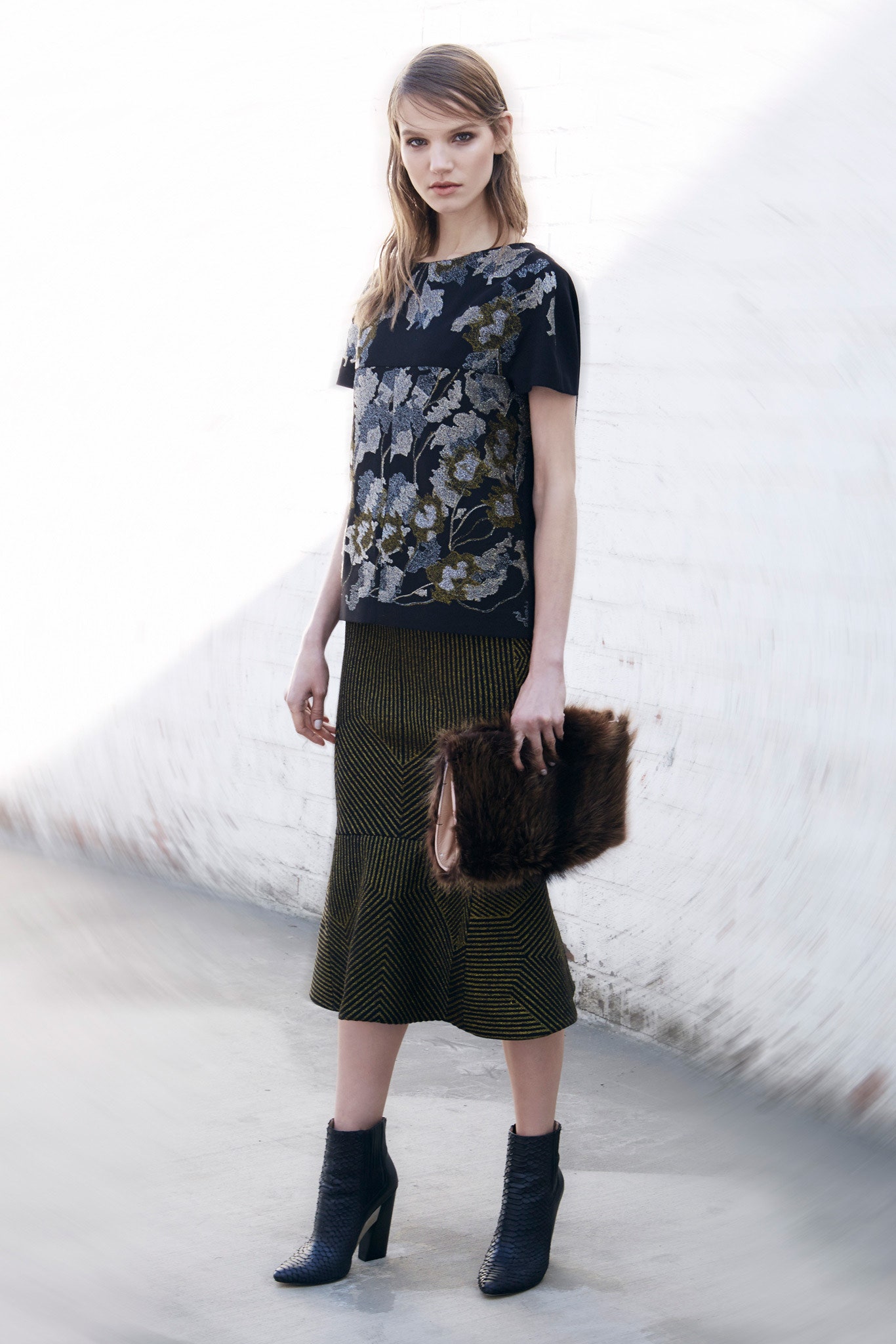 black embroidered top and flared skirt