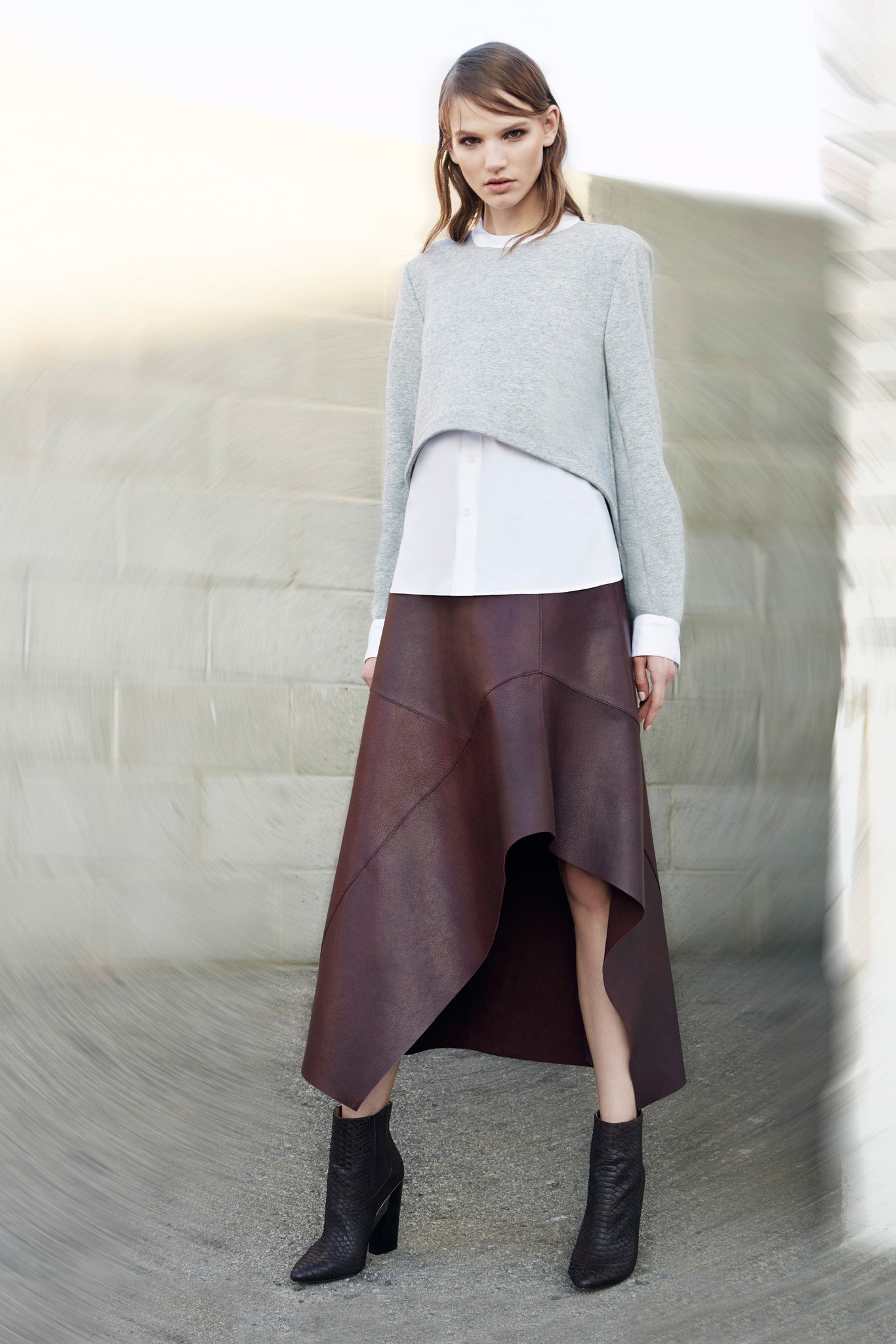 gray wool cropped sweater with brown leather skirt
