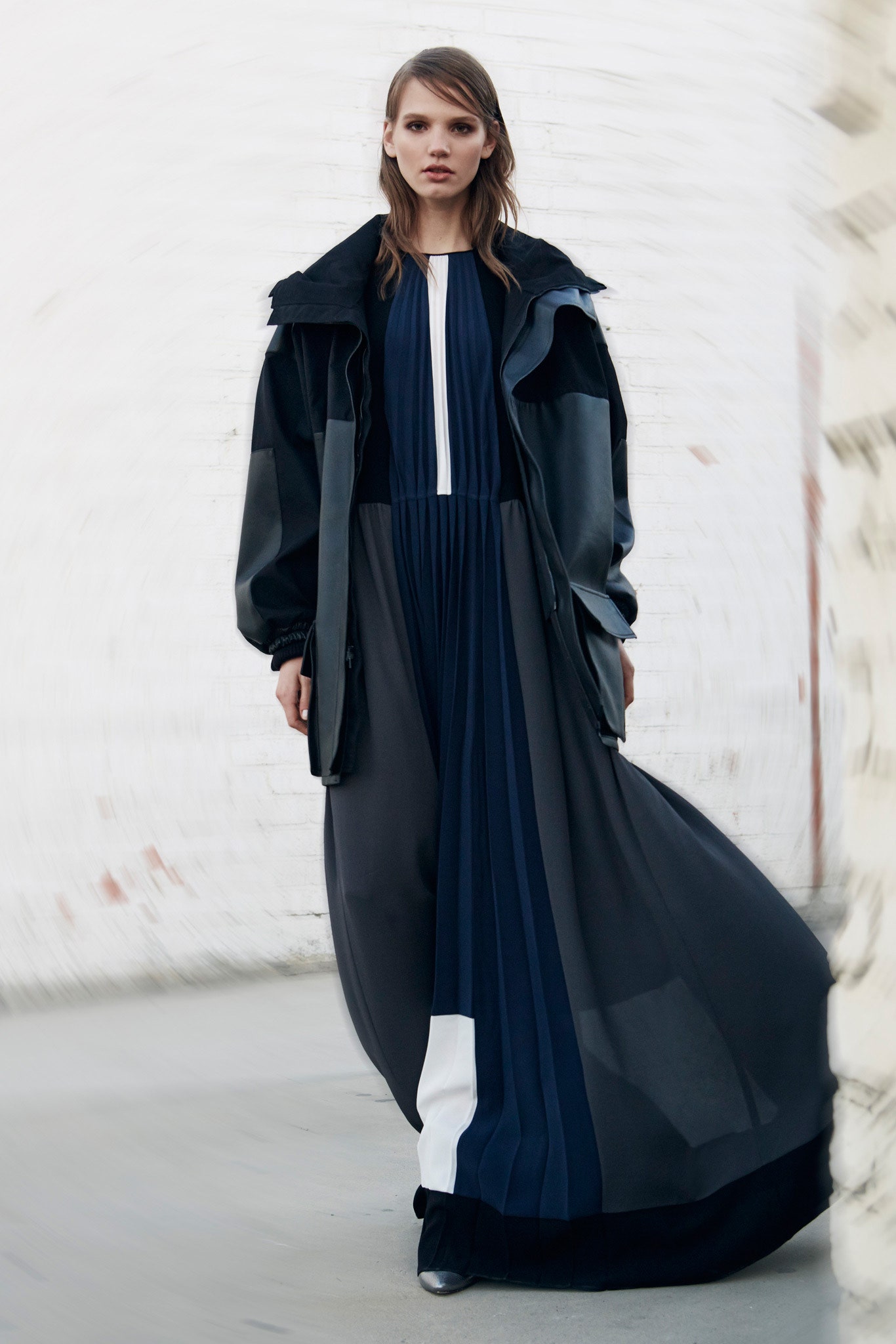 black and blue pleated maxi dress with leather jacket