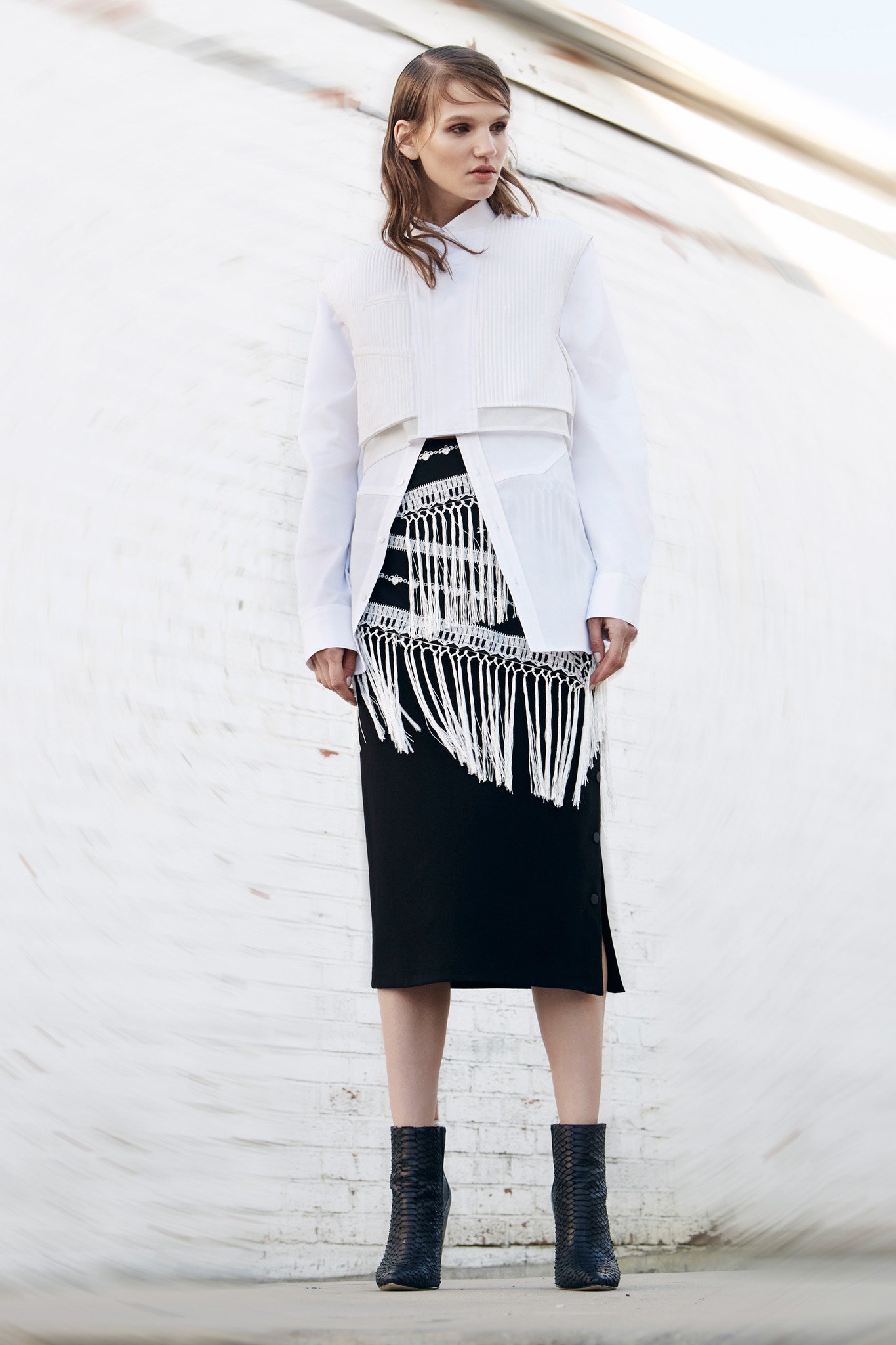 white pleated shirt black fringed skirt