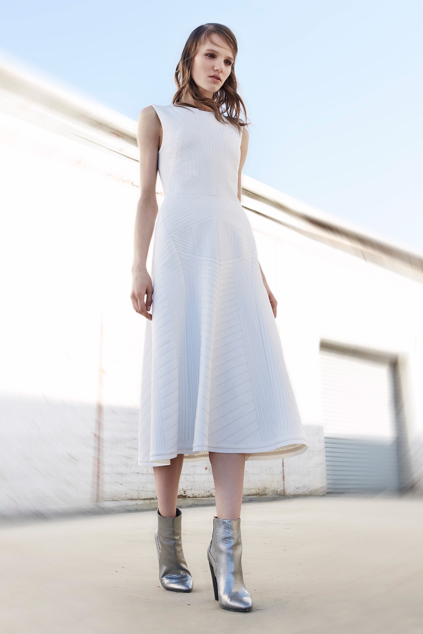 white fitted midi dress with silver boots