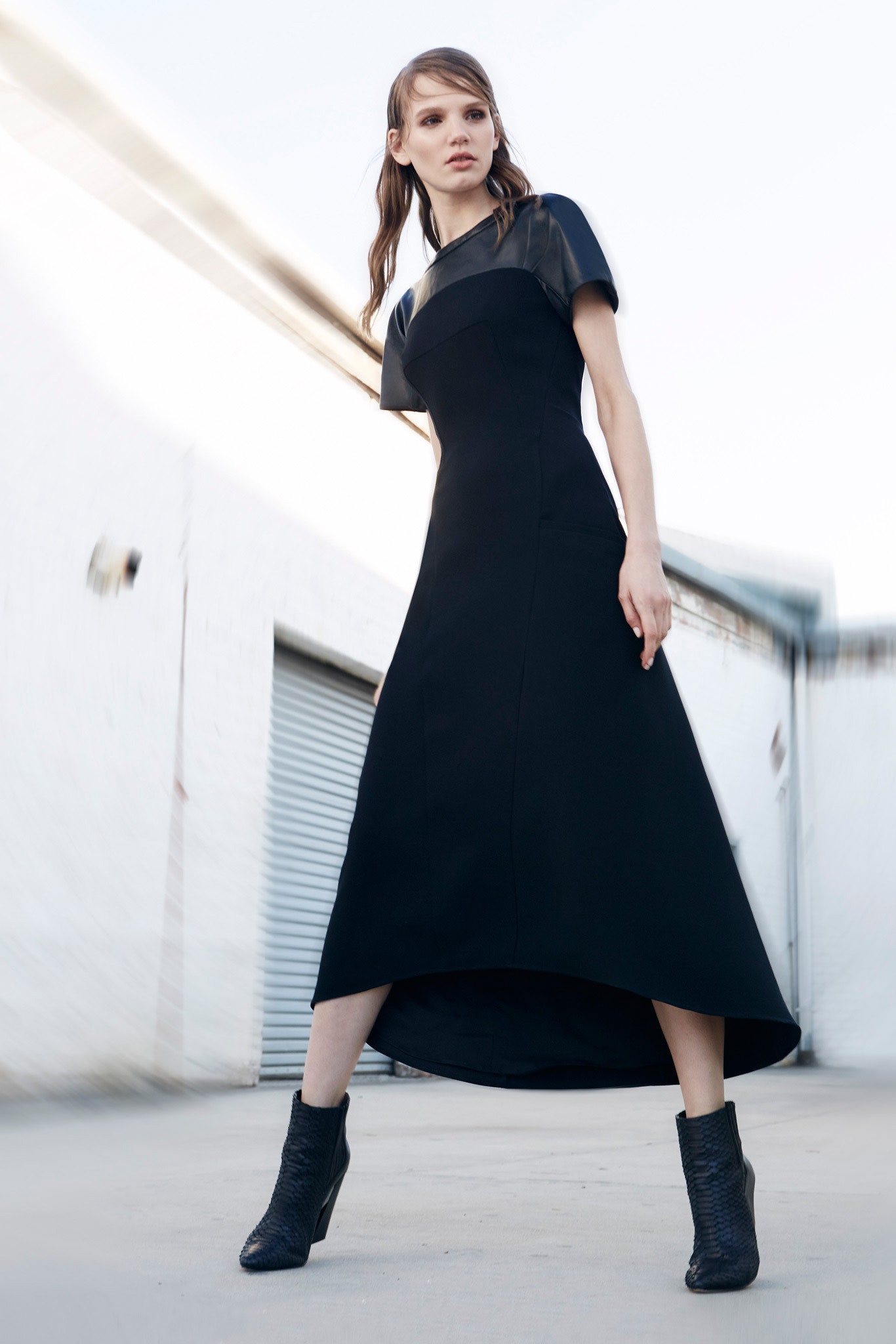 black fitted midi dress with boots