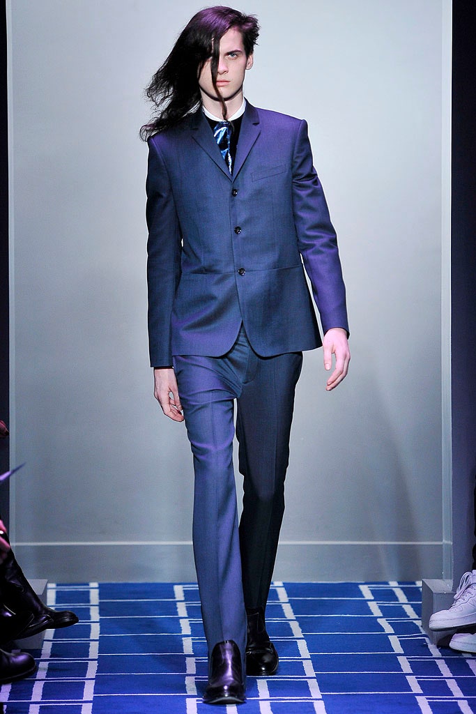 blue tailored suit with black shoes
