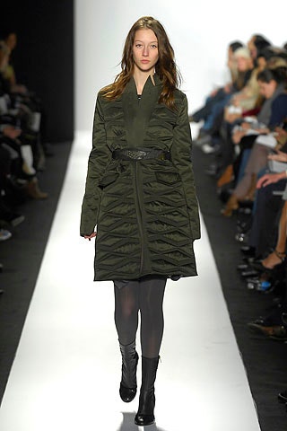green quilted coat with black boots