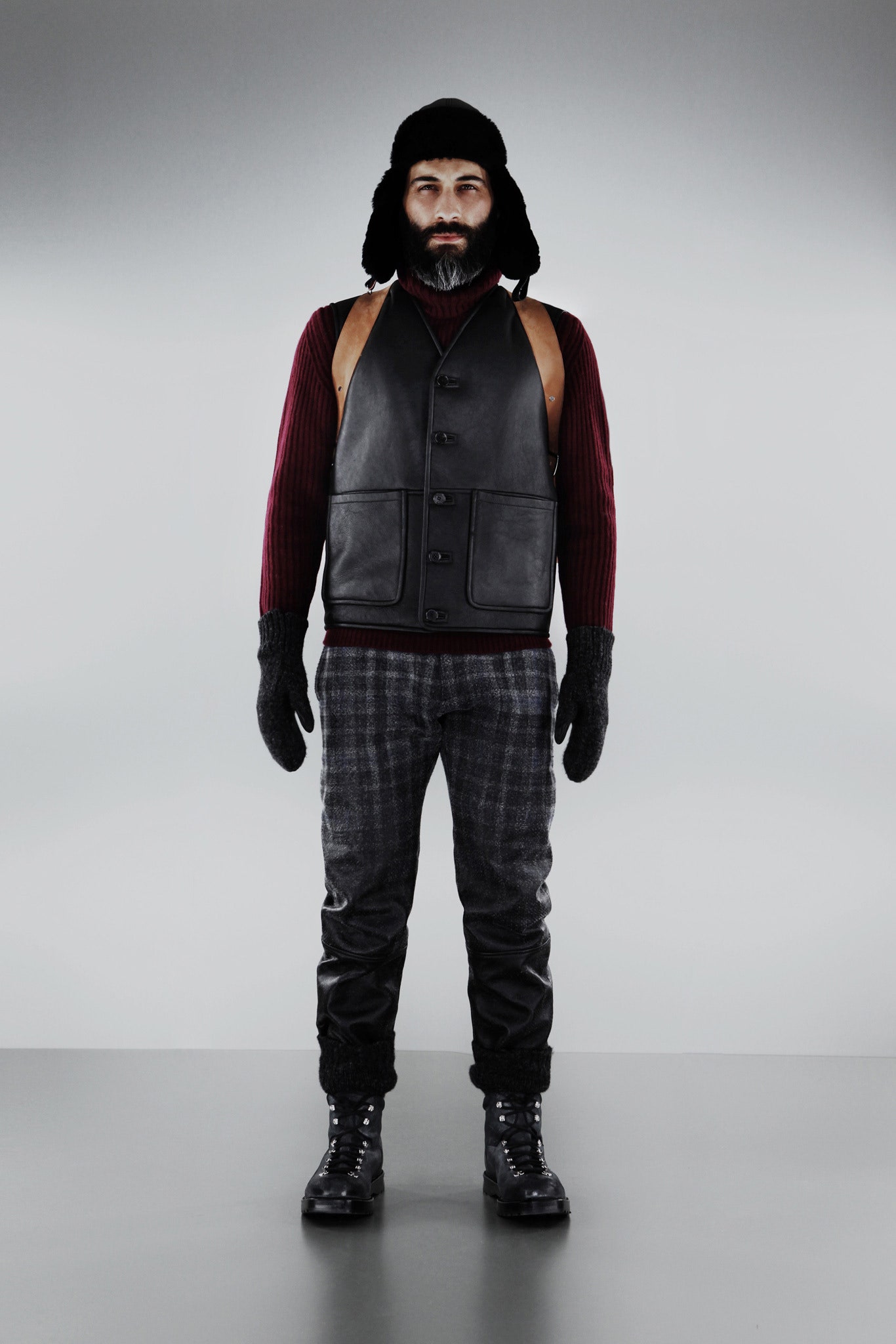 black leather vest with red sweater