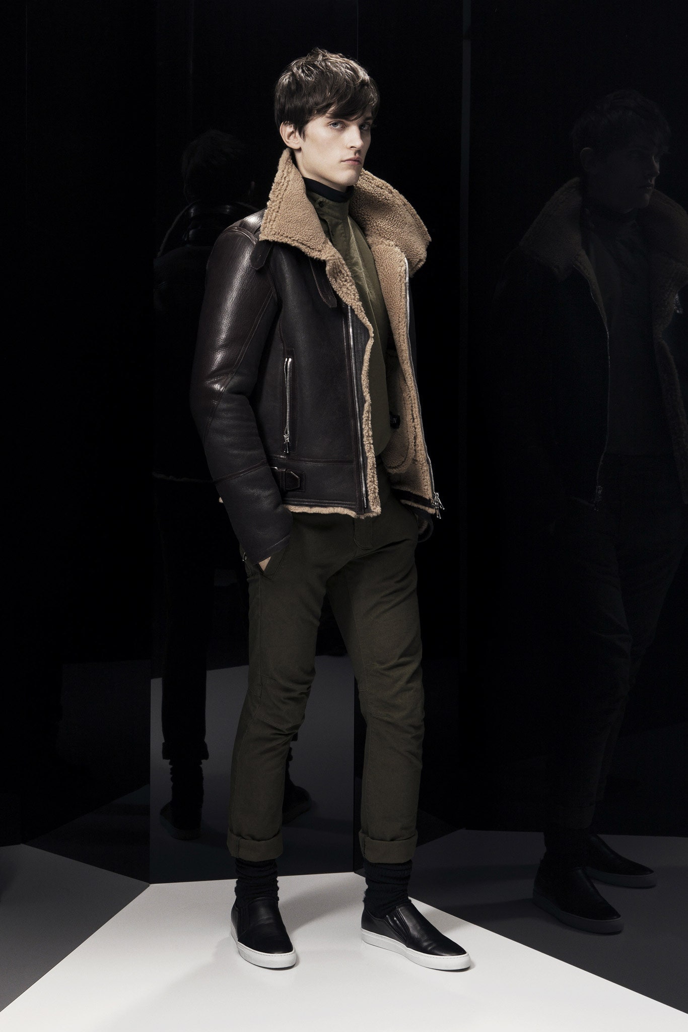 brown leather jacket with green pants